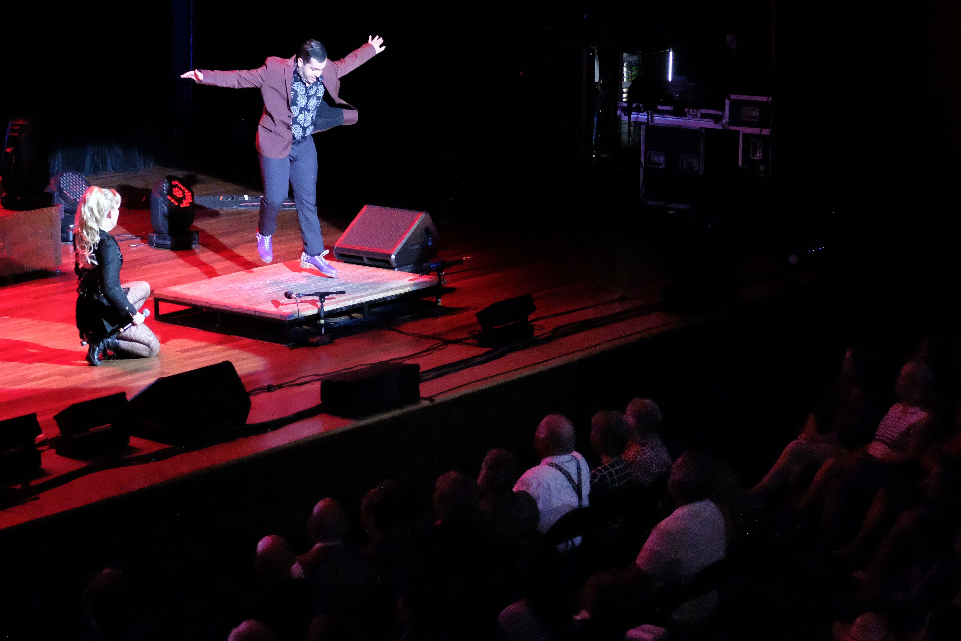 A dancer performs on stage at the Ryman Auditorium during a concert by the band Postmodern Jukebox in Nashville, Tenn., on July 30, 2024.