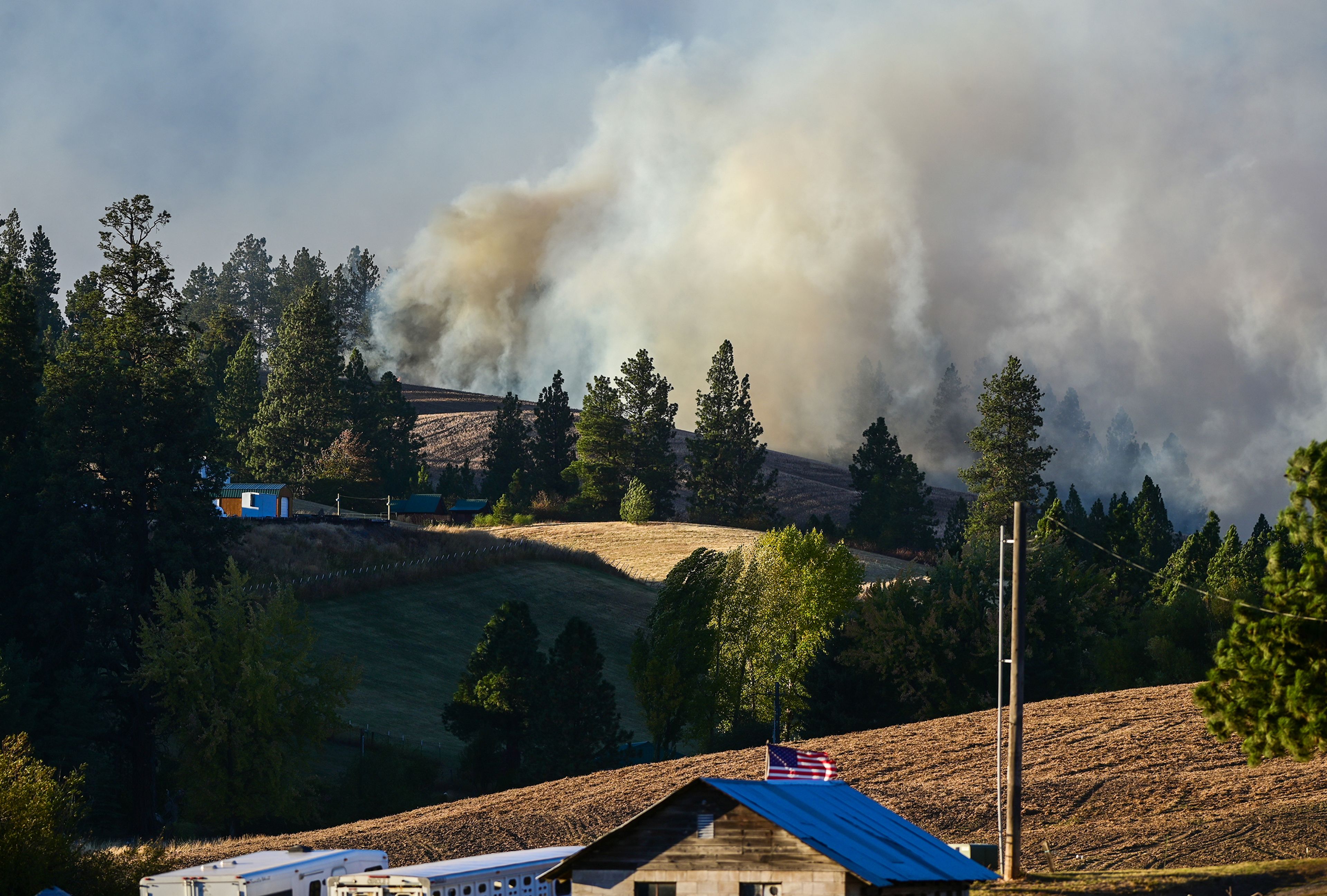 Smoke rises from a wildfire from the viewpoint of Riehle Road Friday in Moscow.,