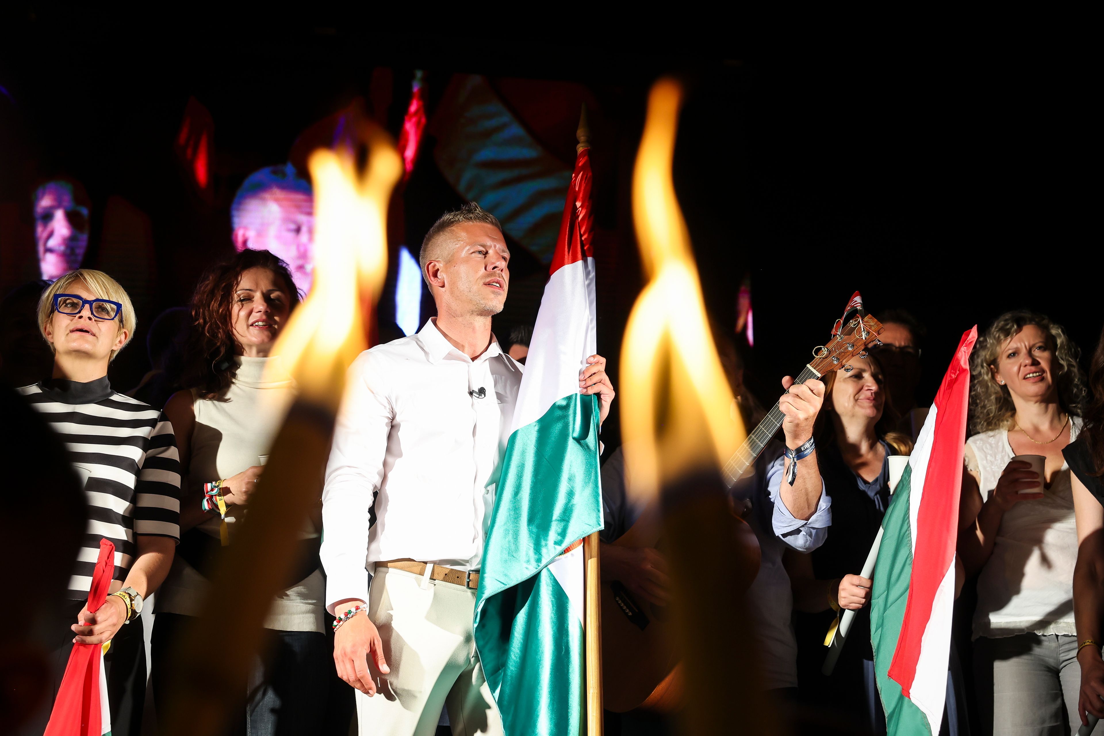 Top candidate for the European elections of the Respect and Freedom (TISZA) Party Peter Magyar sings with his supporters during the party's election night party after the European Parliament and local elections in Budapest, Hungary, early Monday, June 10, 2024.