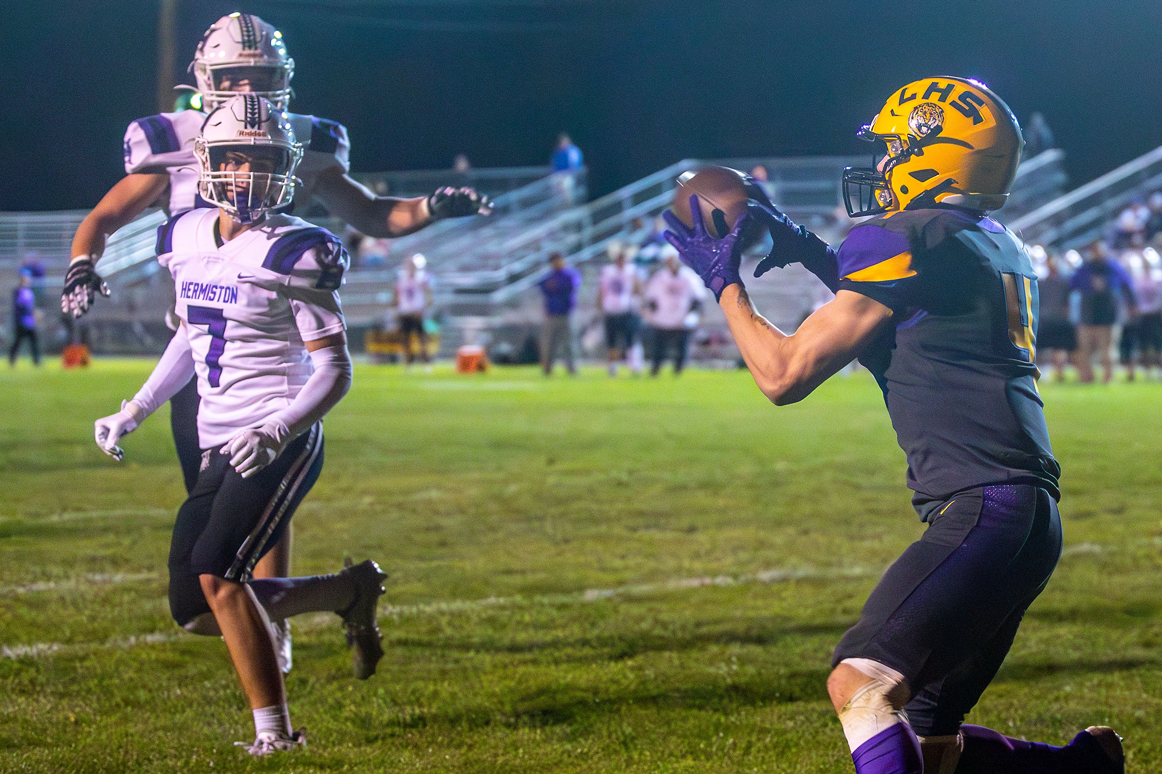 Lewiston running back Noah Carpenter makes a catch in the end zone for a touchdown against Hermiston during a nonconference game at Bengal Field Friday in Lewiston.,