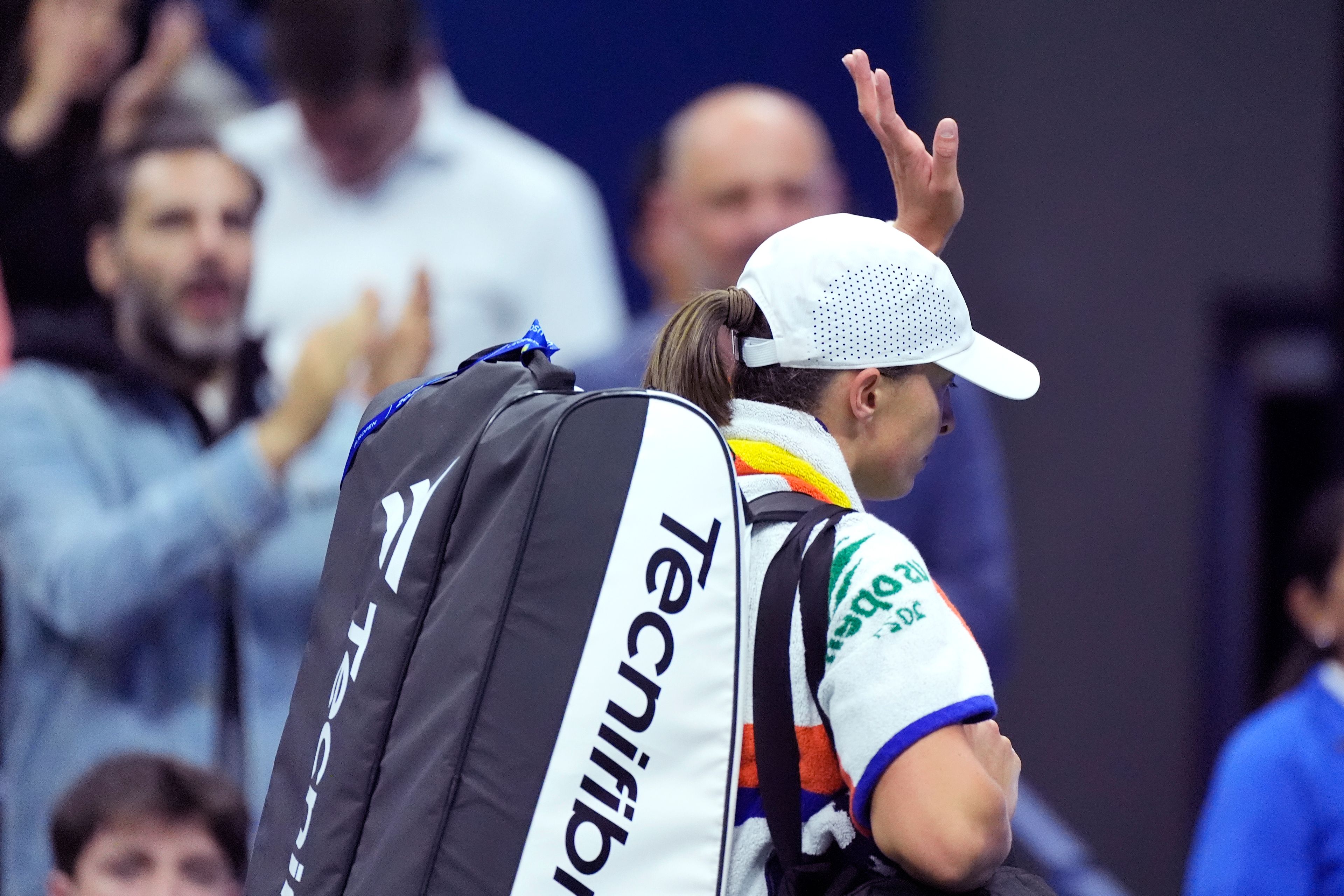 Iga Świątek, of Poland, waves to the crowd after her loss to Jessica Pegula, of the United States, during the quarterfinals of the U.S. Open tennis championships, Wednesday, Sept. 4, 2024, in New York.