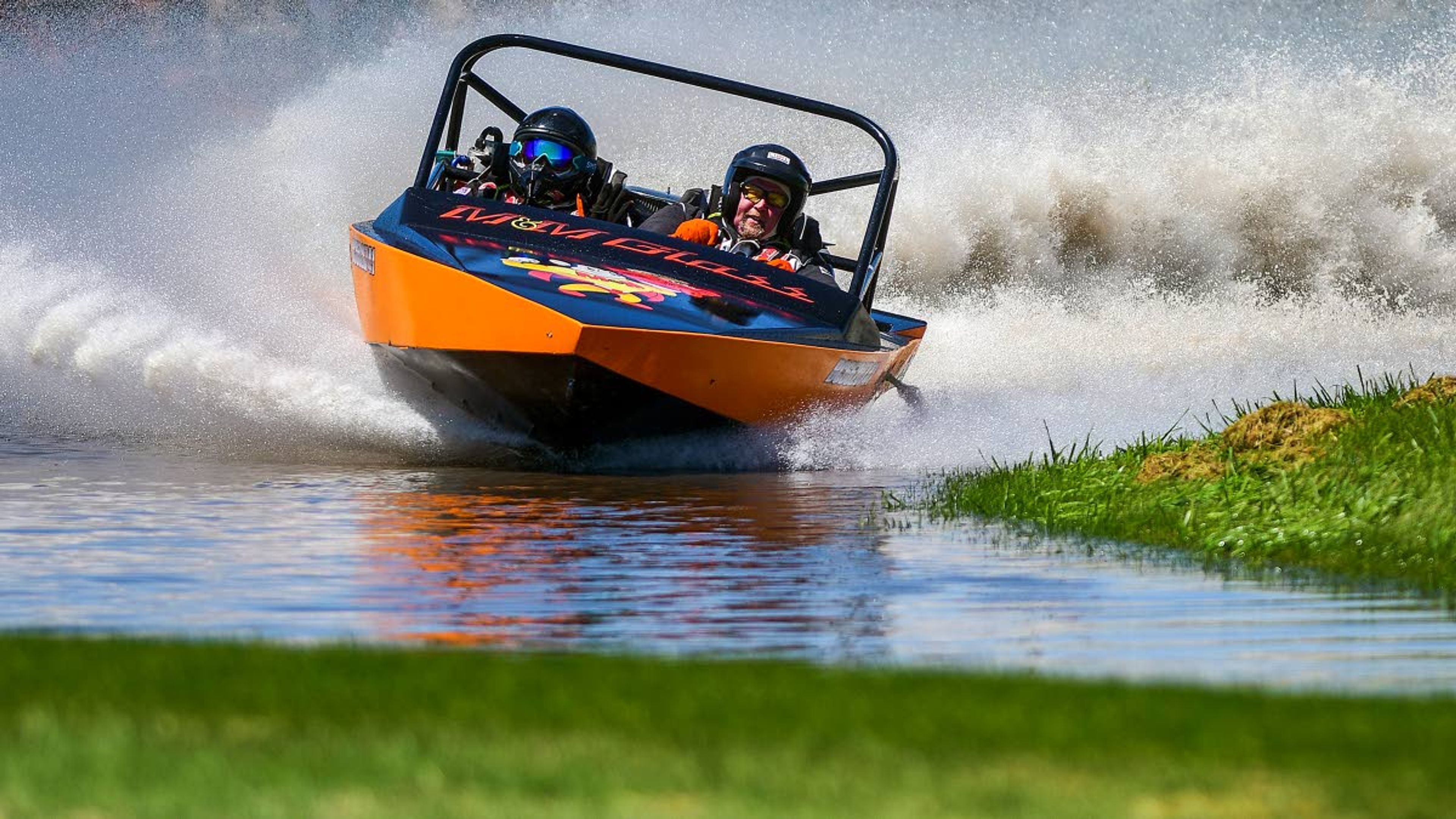 Fat Buddy's Scott Saxton turns a corner as navigator Taydra Reichert hangs on during a qualifying heat in the 400 Class of the Webb's Slough sprint boat races on Saturday in St. John.