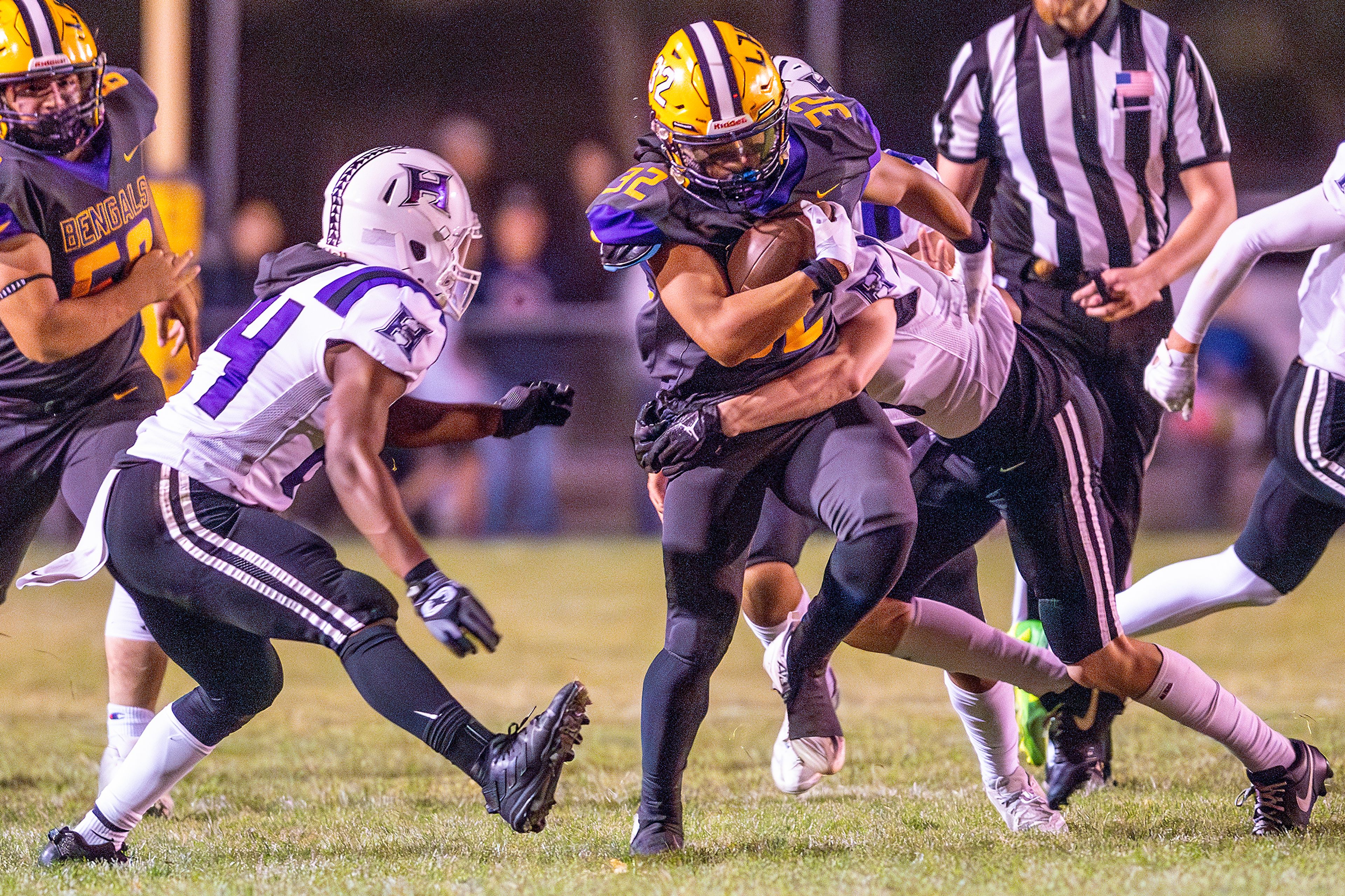 Lewiston running back Austin Topp runs the ball against Hermiston during a nonconference game at Bengal Field Friday in Lewiston.,