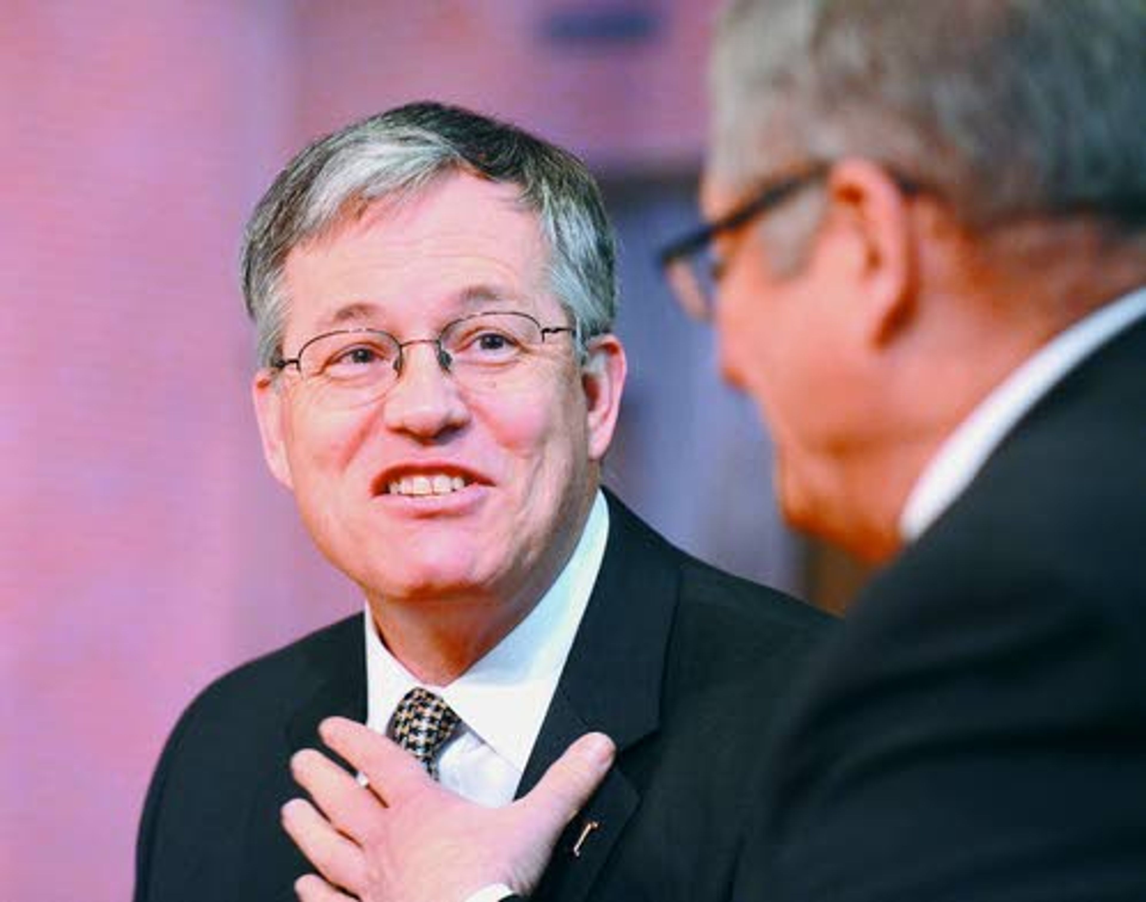 University of Idaho President Chuck Staben has a laugh with Idaho State Board of Education member Bill Goesling prior to being introduced at UI Monday.