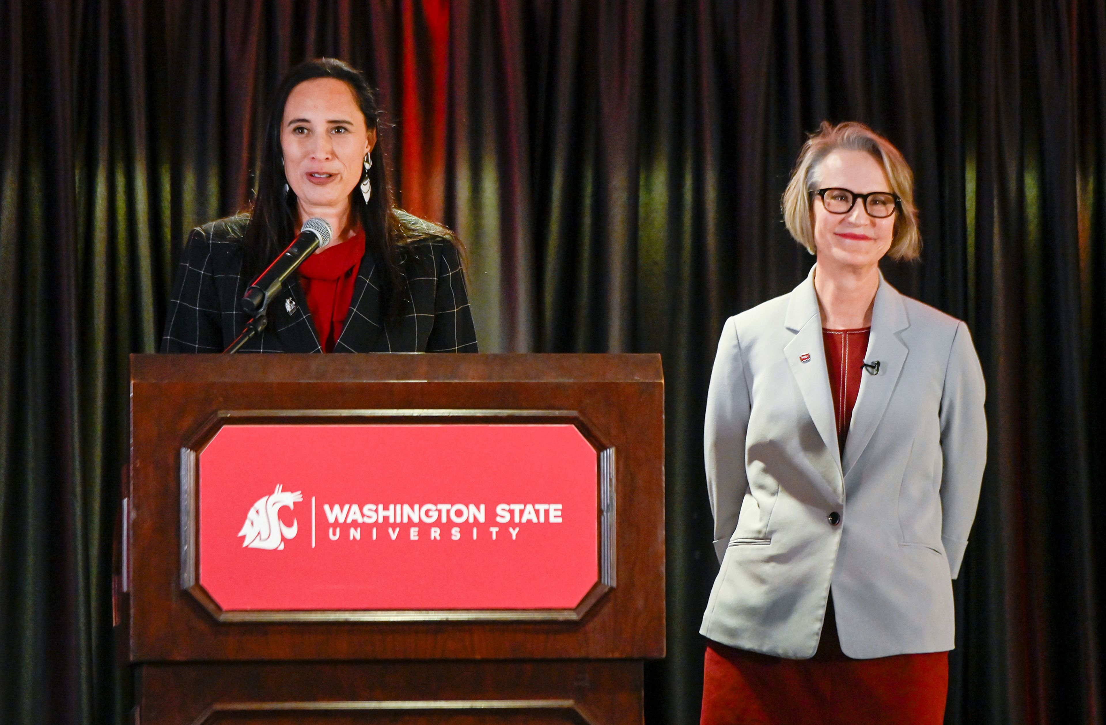 Lisa Keohokalole Schauer, left, Washington State University Board of Regents chair, introduces Elizabeth “Betsy” Cantwell, as the newly appointed WSU president Thursday at a regents meeting in Pullman.