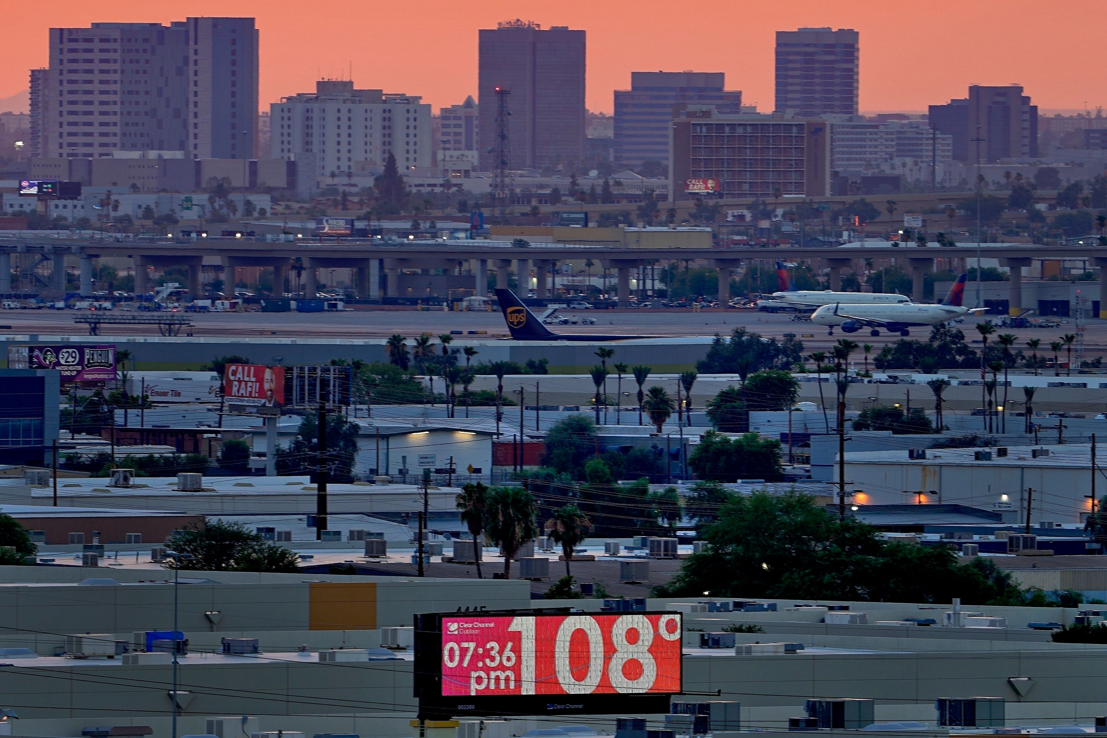 FILE - The unofficial temperature hits 108 degrees at dusk at Sky Harbor International Airport in Phoenix on July 12, 2023. Phoenix saw 20 consecutive days of extreme heat stress in July, the longest run of such dangerously hot days in the city since at least 1940, according to the data from the Copernicus Climate Change Service. The death certificates of more than 2,300 people who died in the United States last summer mention the effects of excessive heat, the highest number in 45 years of records, according to an Associated Press analysis of Centers for Disease Control and Prevention data. With May already breaking heat records, 2024 could be even deadlier. (AP Photo/Matt York, File)