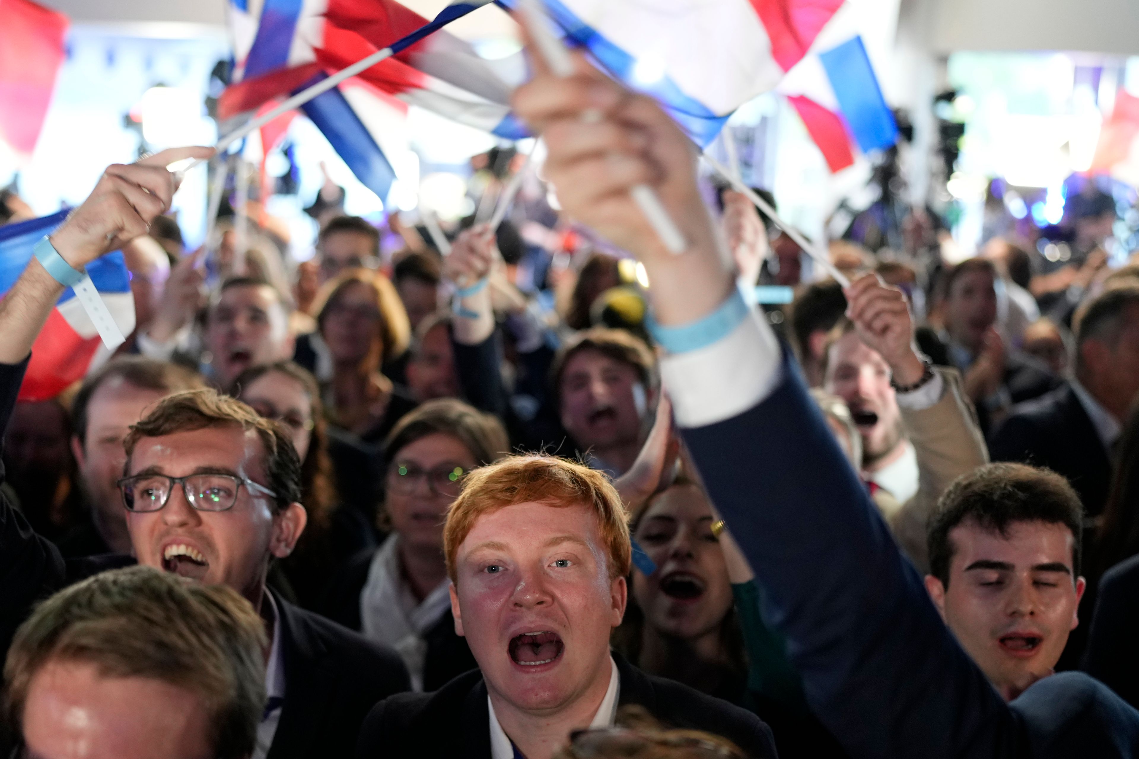 Supporters of French far-right National Rally react at the party election night headquarters, Sunday, June 9, 2024 in Paris. First projected results from France put far-right National Rally party well ahead in EU elections, according to French opinion poll institutes.