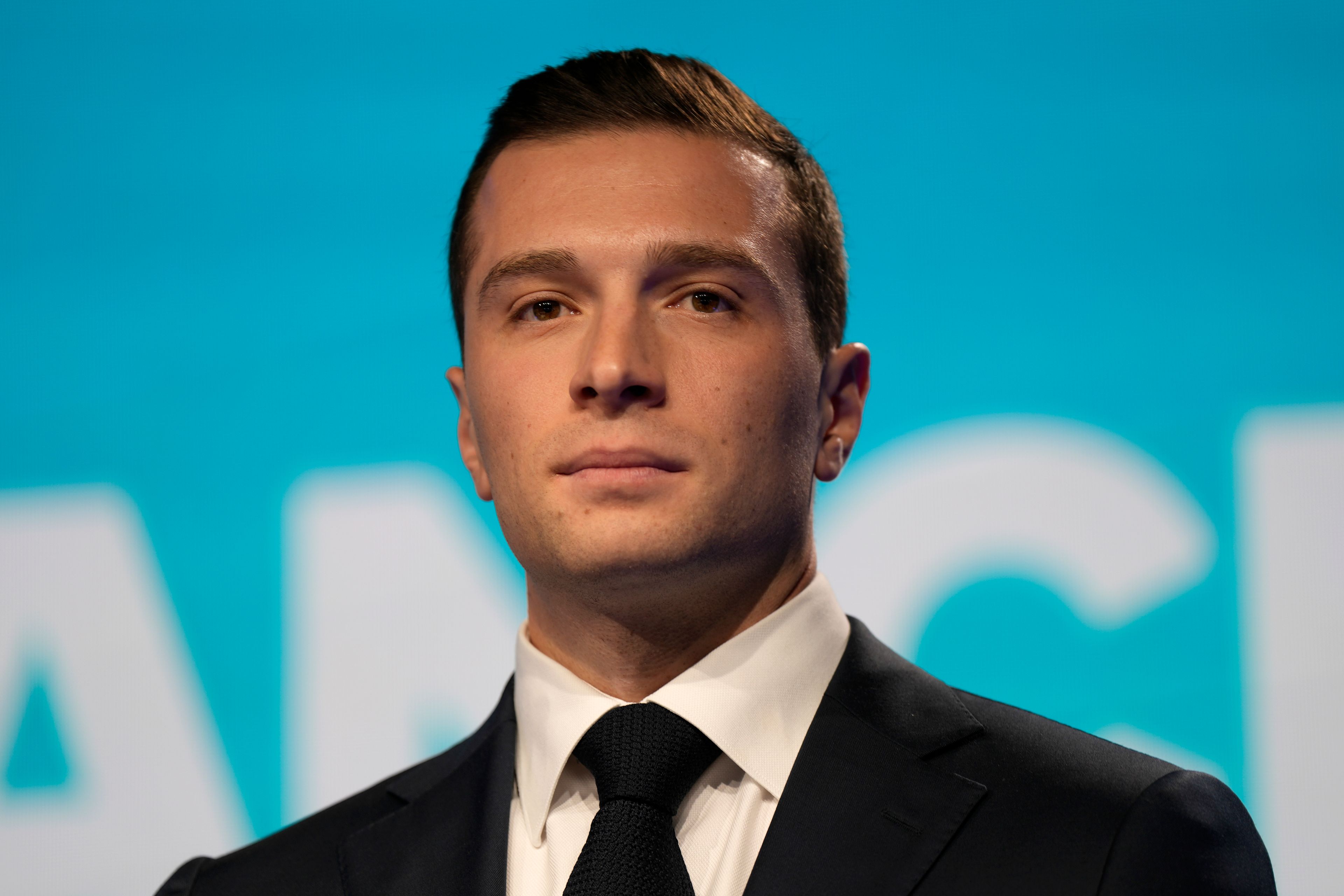 Jordan Bardella, president of the French far-right National Rally, is seen at the party election night headquarters after French President Emanuel Macron announced he dissolves National Assembly and calls new legislative election after defeat in EU vote, Sunday, June 9, 2024 in Paris. First projected results from France put far-right National Rally party well ahead in EU elections, according to French opinion poll institutes.