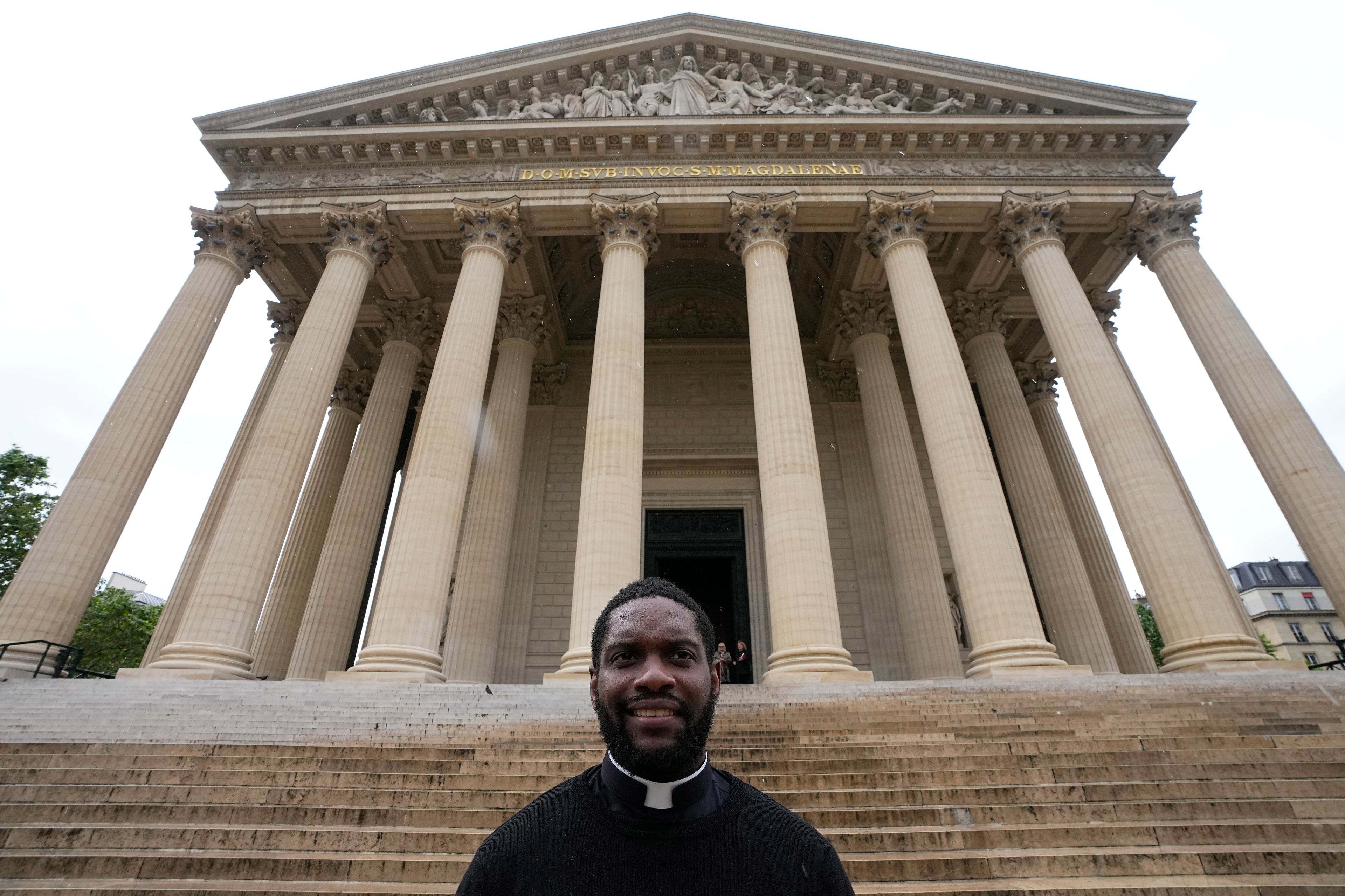 Jason Nioka, a former judo champion and deacon who's in charge of the largest contingent of Olympic chaplains, about 40 priests, nuns and lay Catholics, poses outside the Madeleine church, Thursday, May 30, 2024 in Paris. As athletes rev up their training and organizers finalize everything from ceremonies to podiums before the Paris Olympics, more than 120 faith leaders are preparing for a different challenge – spiritually supporting some 14,000 participants from around the world, especially those whose medal dreams will inevitably get crushed.