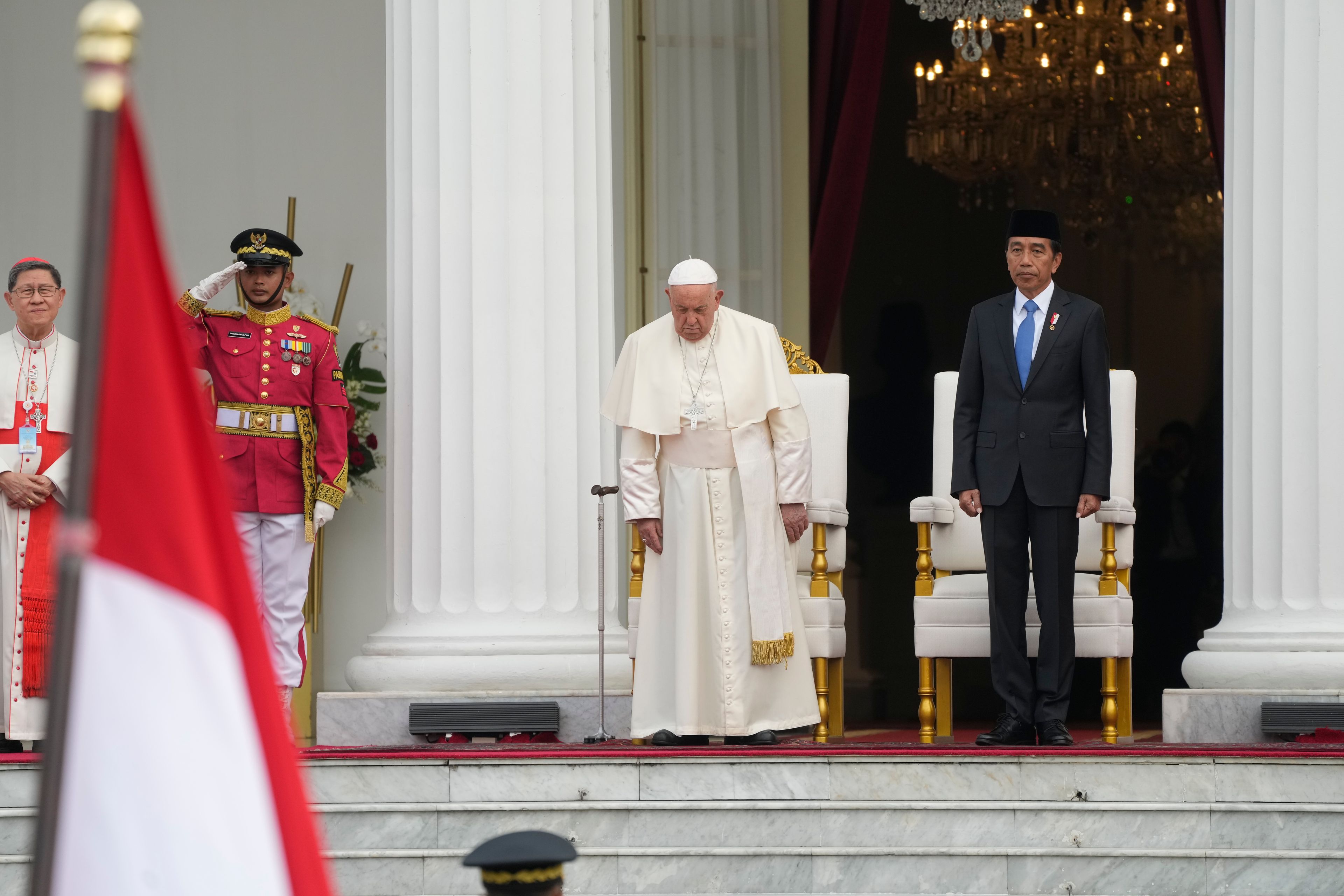 Indonesian President Joko Widodo, right, receives Pope Francis, center, at Istana Merdeka Presidential Palace in Jakarta, Wednesday, Sept. 4, 2024. Pope Francis is opening his visit to Indonesia with a packed first day Wednesday, meeting political and religious leaders and setting a rigorous pace for an 11-day, four-nation trip through tropical Asia and Oceania that will test his stamina and health.