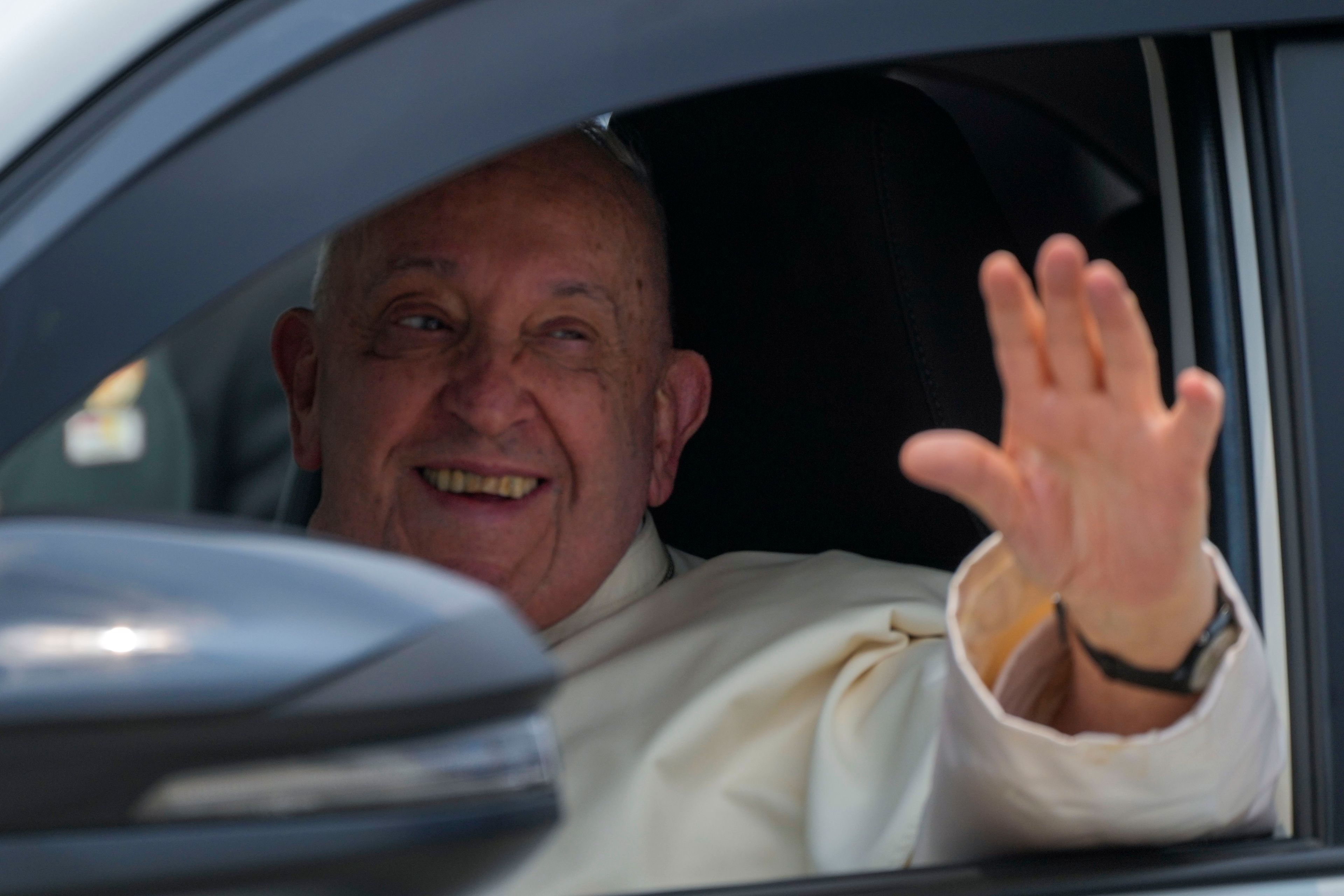 Pope Francis leaves in a car soon after landing at Jakarta's International airport Soekarno Hatta, Tuesday, Sept. 3, 2024. Pope Francis arrived in Indonesia on Tuesday at the start of the longest trip of his pontificate, hoping to encourage its Catholic community and celebrate the tradition of interfaith harmony in a country with the world's largest Muslim population.