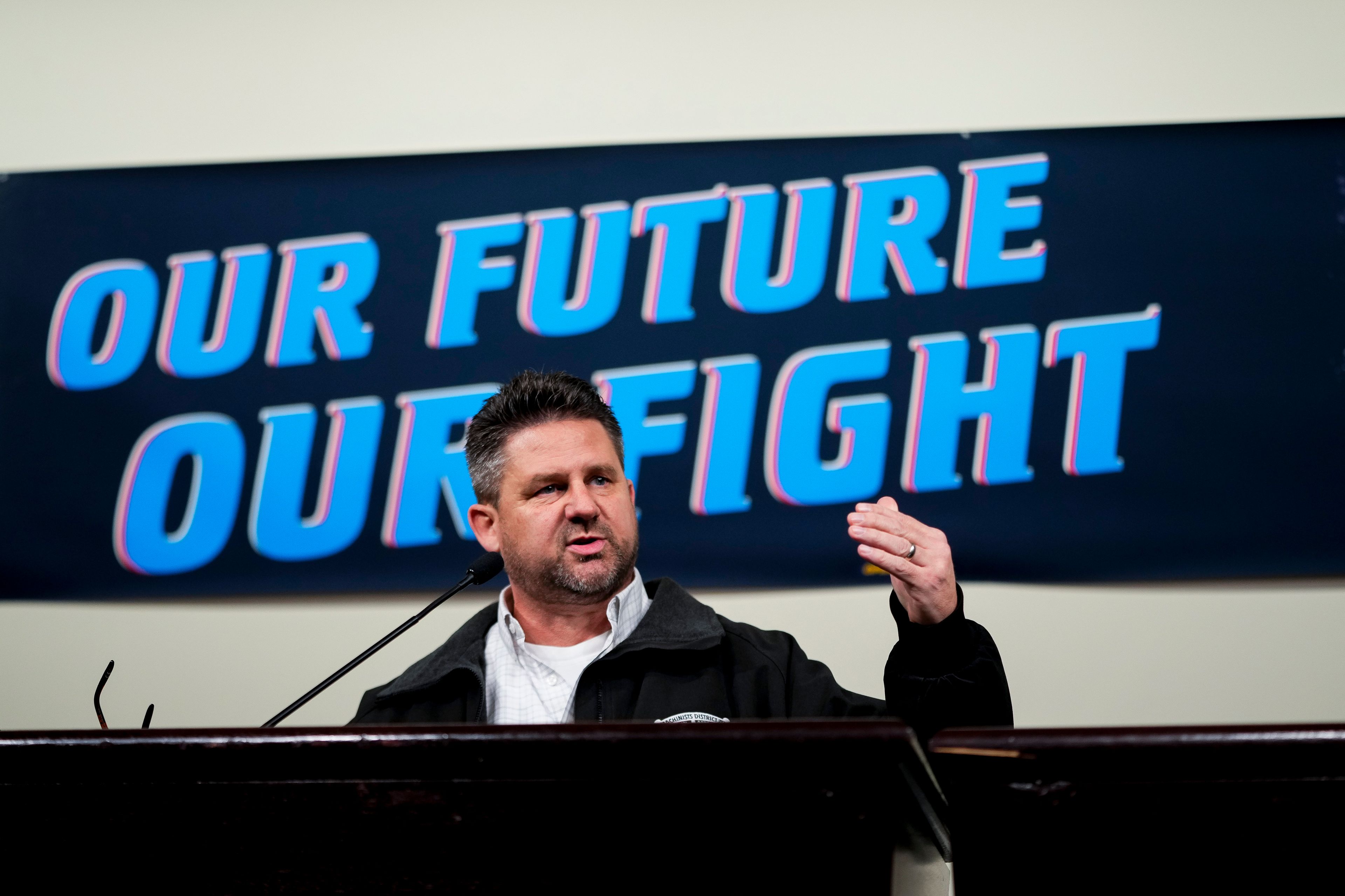 IAM District 751 president Jon Holden speaks to union members while announcing that they voted to reject a new contract offer from Boeing, Wednesday, Oct. 23, 2024, at Seattle Union Hall in Seattle. (AP Photo/Lindsey Wasson)