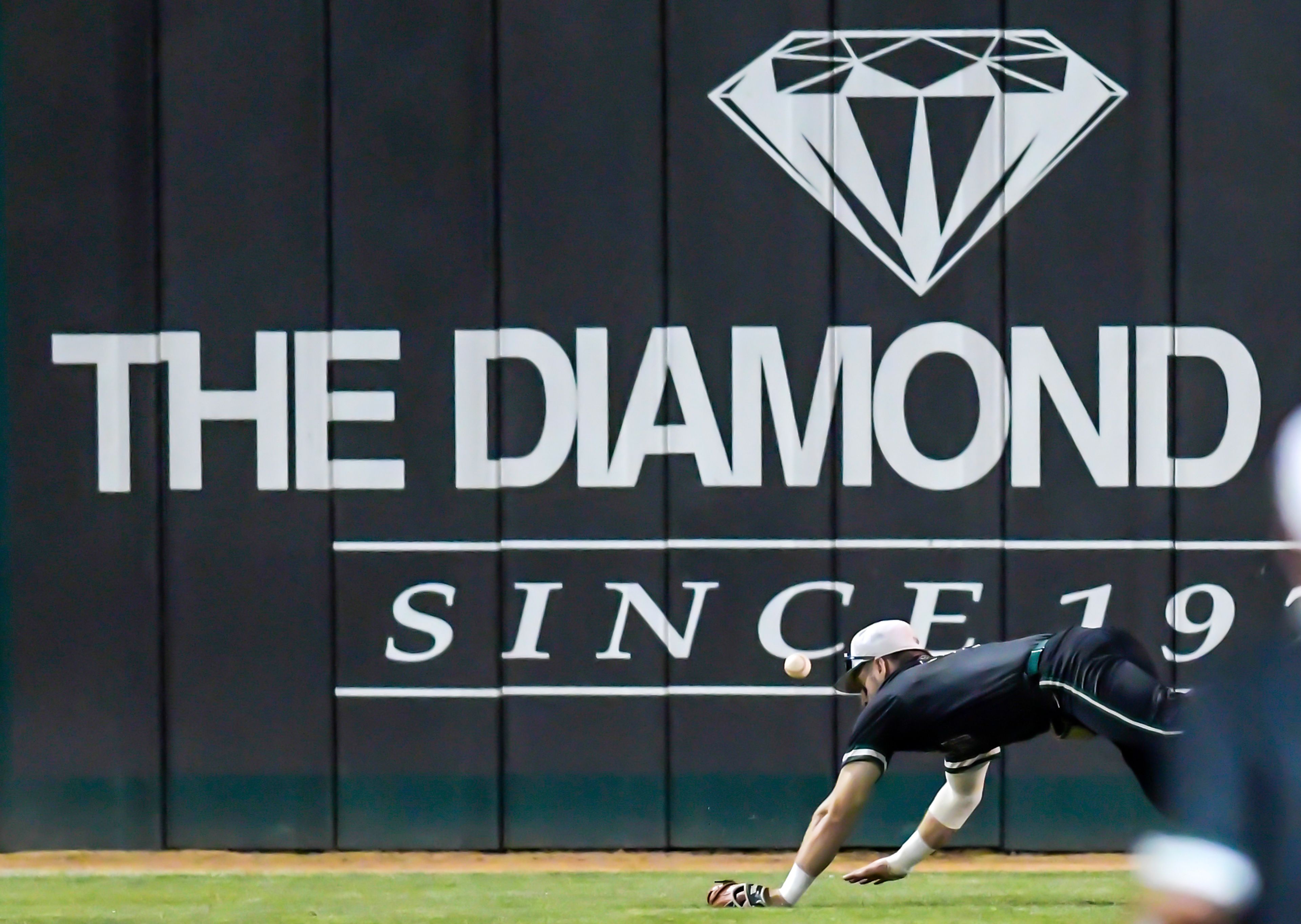 Georgia Gwinnett center fielder Ajay Sczepkowski misses a catch against Tennessee Wesleyan in Game 12 of the NAIA World Series at Harris Field Monday in Lewiston.