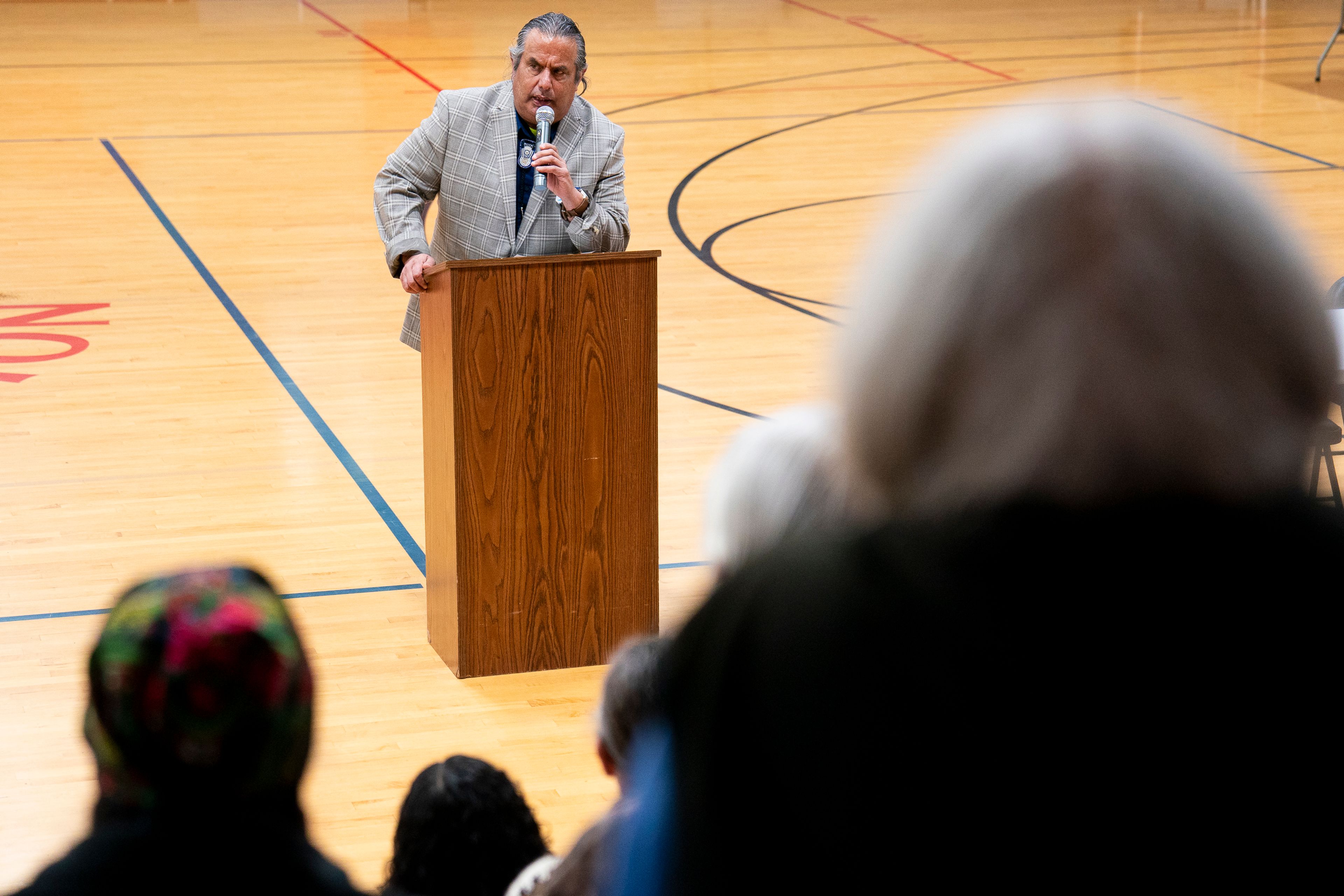 Nimiipuu Protecting the Environment coordinator Julian Matthews speaks to the crowd during the Honor the Wolf Ceremony inside Pi-Nee-Waus Community Center in Lapwai on Saturday