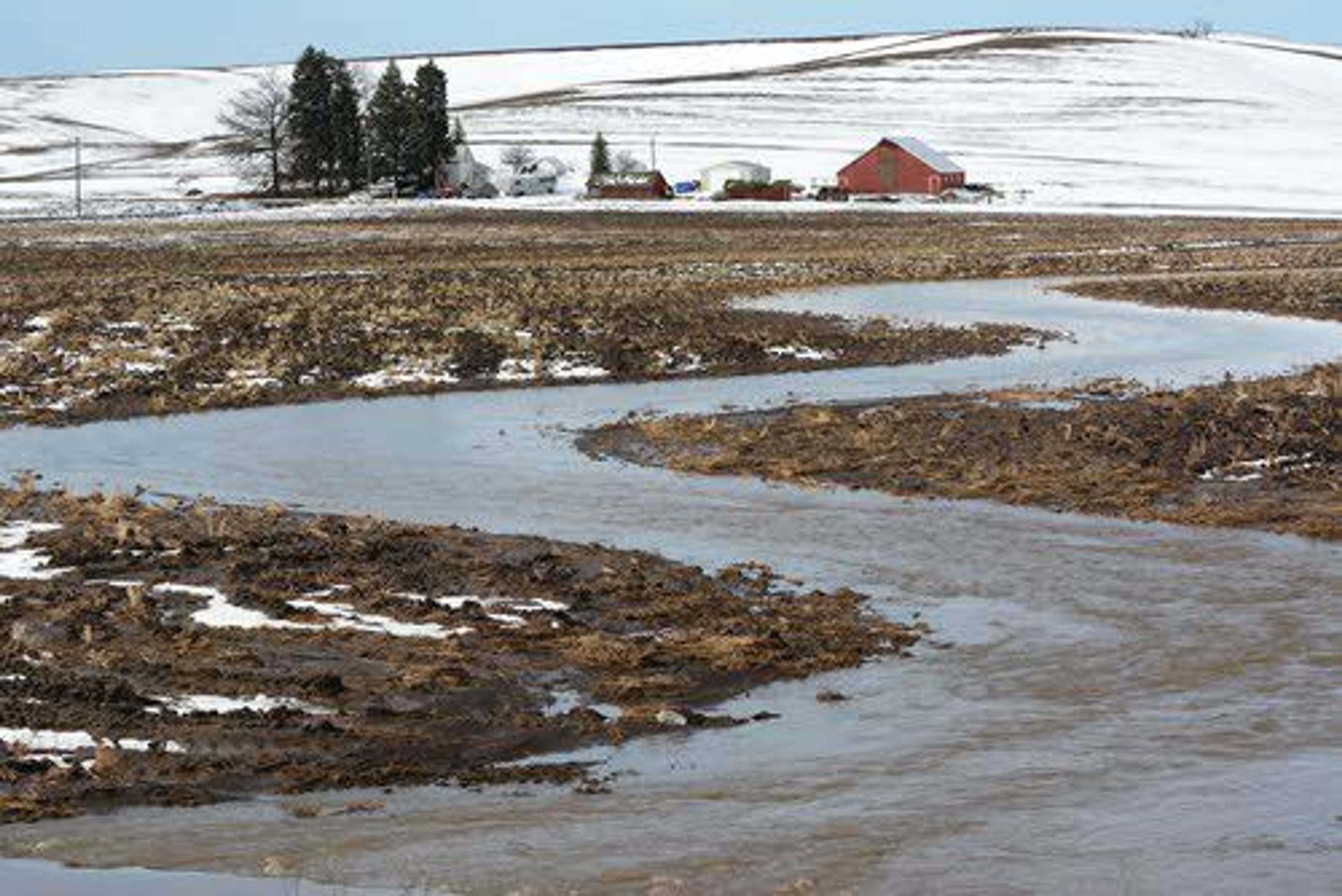 Cow Creek near Genesee has jumped its banks, creating a new channel through a farm field as heavy snow melt and overnight rain helped create high-water conditions Friday morning. Warmer temperatures and increasing chances of precipitation are expected to bring additional melt over the next few days, according to the National Weather Service in Spokane. For more weather information, see Page 6A.