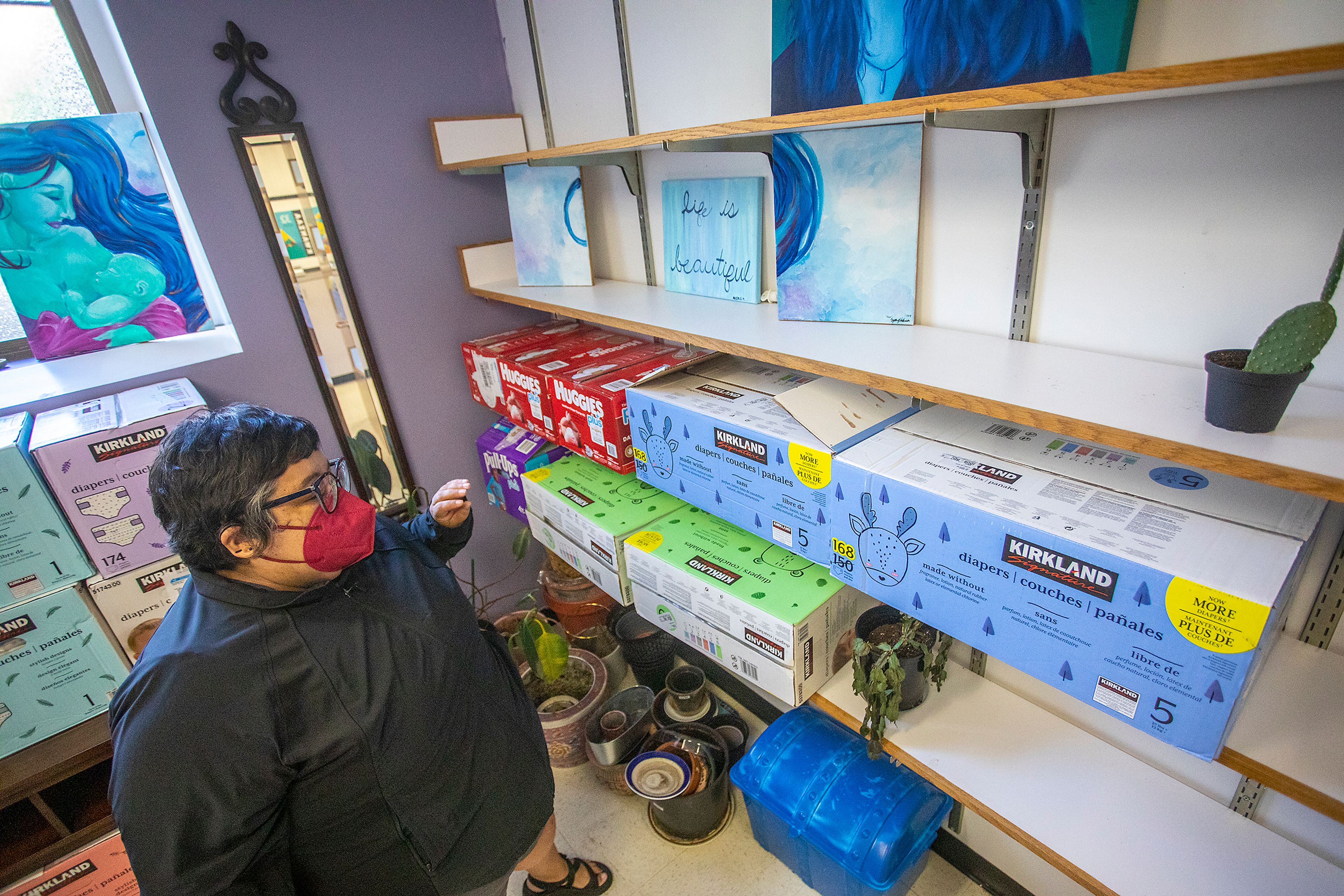 Sharp shows the various diapers and other supplies the WSU Women*s Center has on hand for anyone in need.