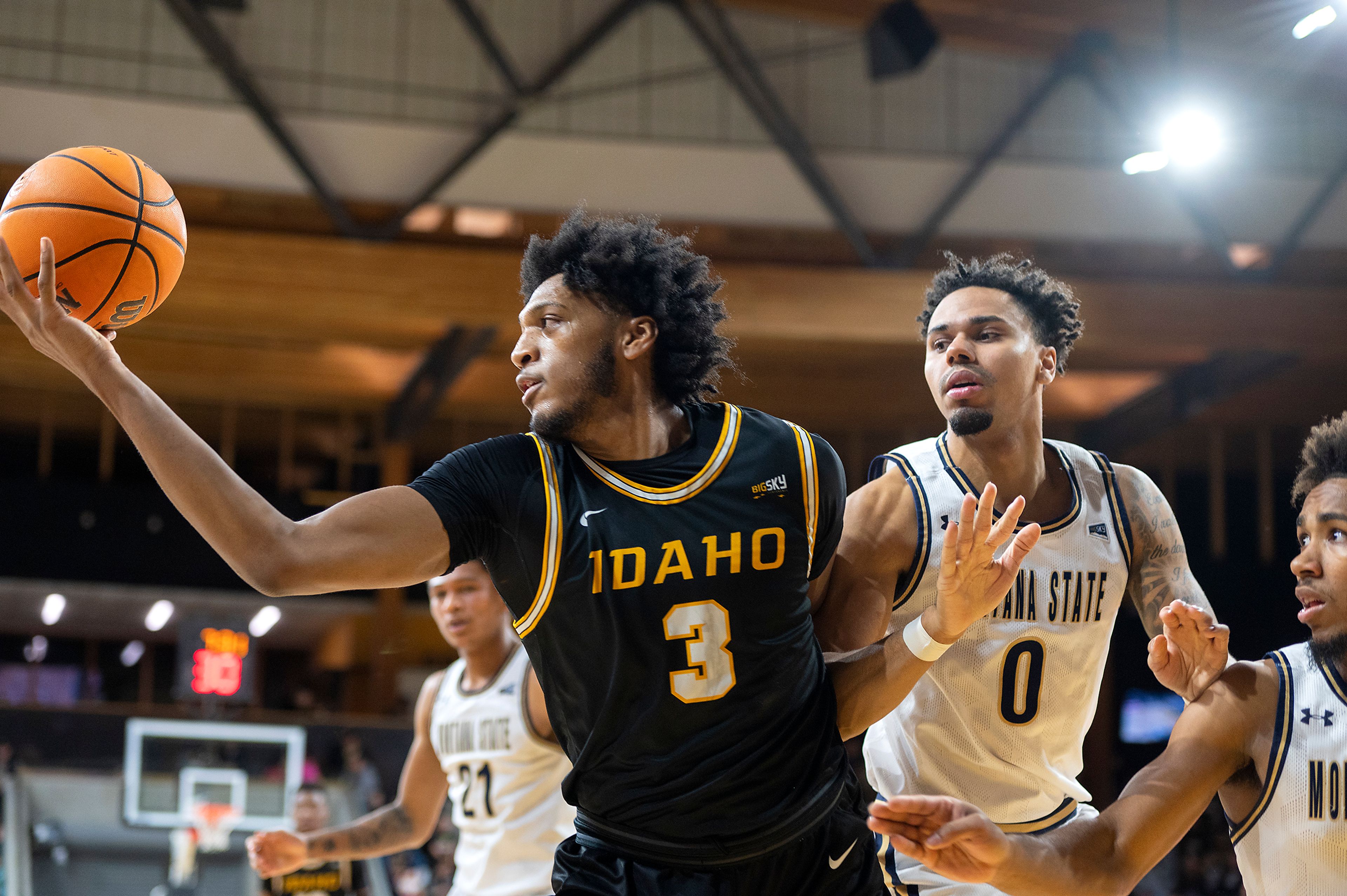 Idaho center Isaac Jones, left, grabs a rebound as Montana State guard Caleb Fuller, right, defends during the first half of a Jan. 16 Big Sky Conference game at Idaho Central Credit Union Arena.