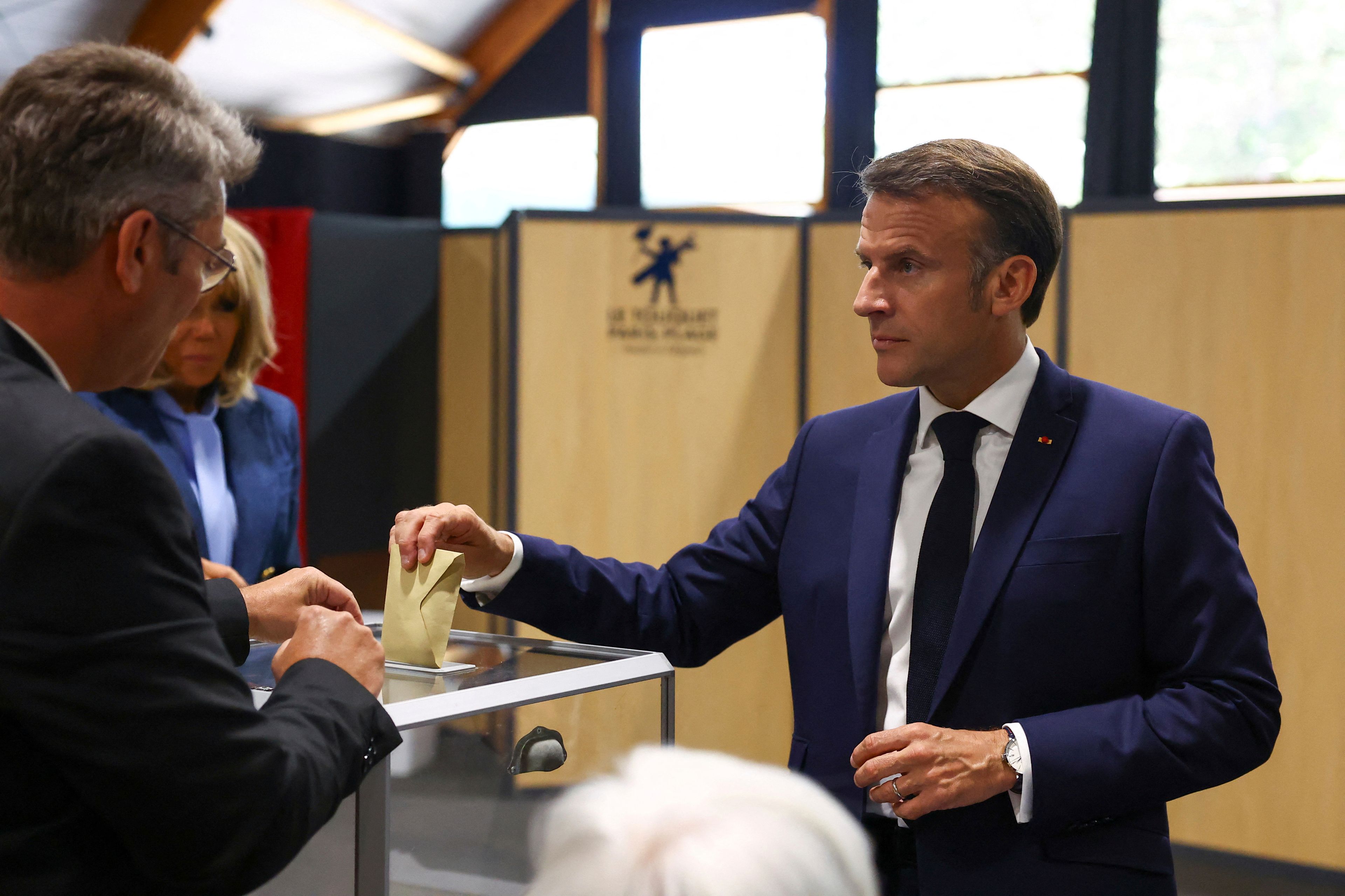 French President Emmanuel Macron votes during the European election, in Le Touquet-Paris-Plage, northern France, Sunday, June 9, 2024. Polling stations opened across Europe on Sunday as voters from 20 countries cast ballots in elections that are expected to shift the European Union's parliament to the right and could reshape the future direction of the world's biggest trading bloc.