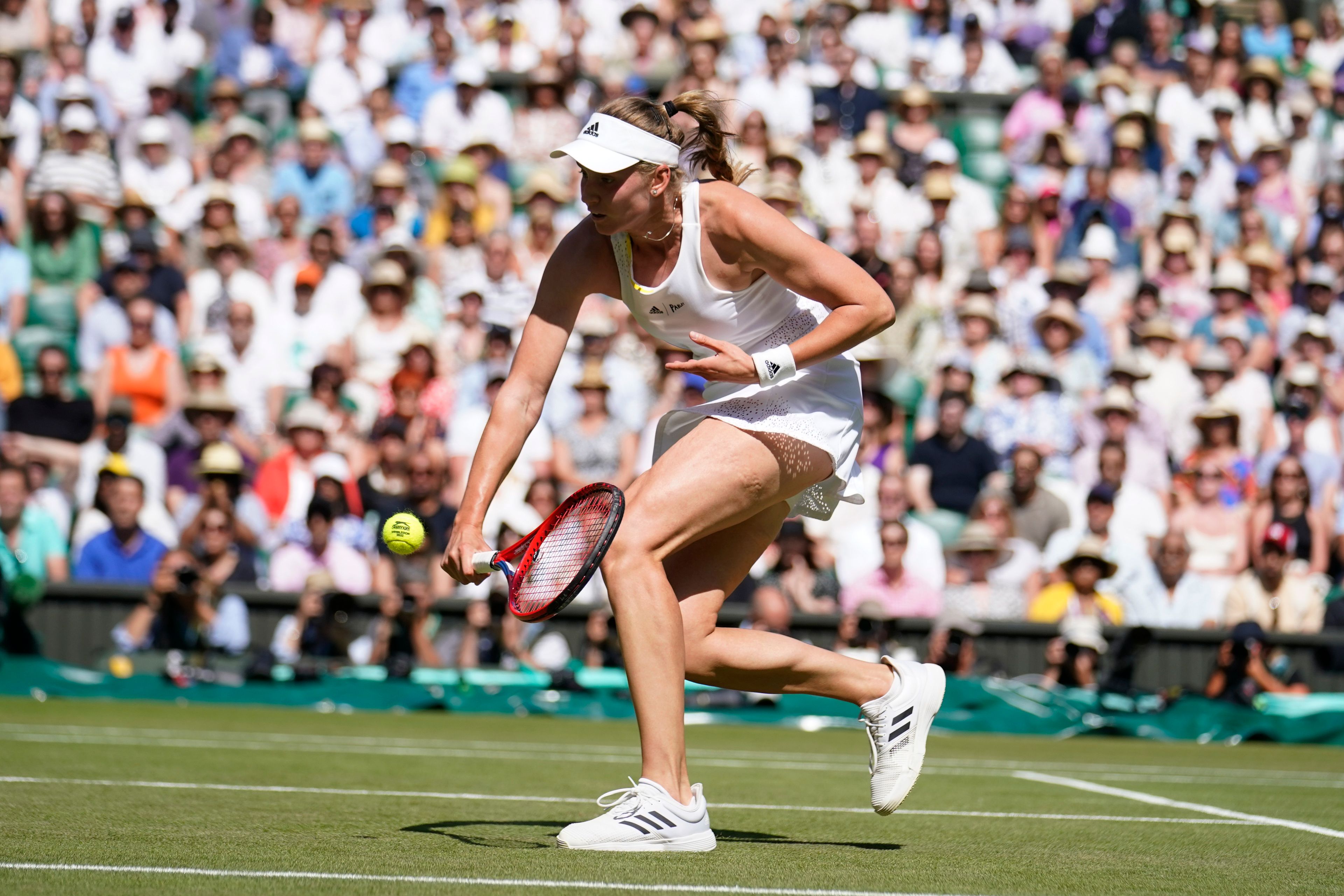 Kazakhstan's Elena Rybakina returns to Tunisia's Ons Jabeur in the final of the women's singles on day thirteen of the Wimbledon tennis championships in London, Saturday, July 9, 2022. (AP Photo/Gerald Herbert)