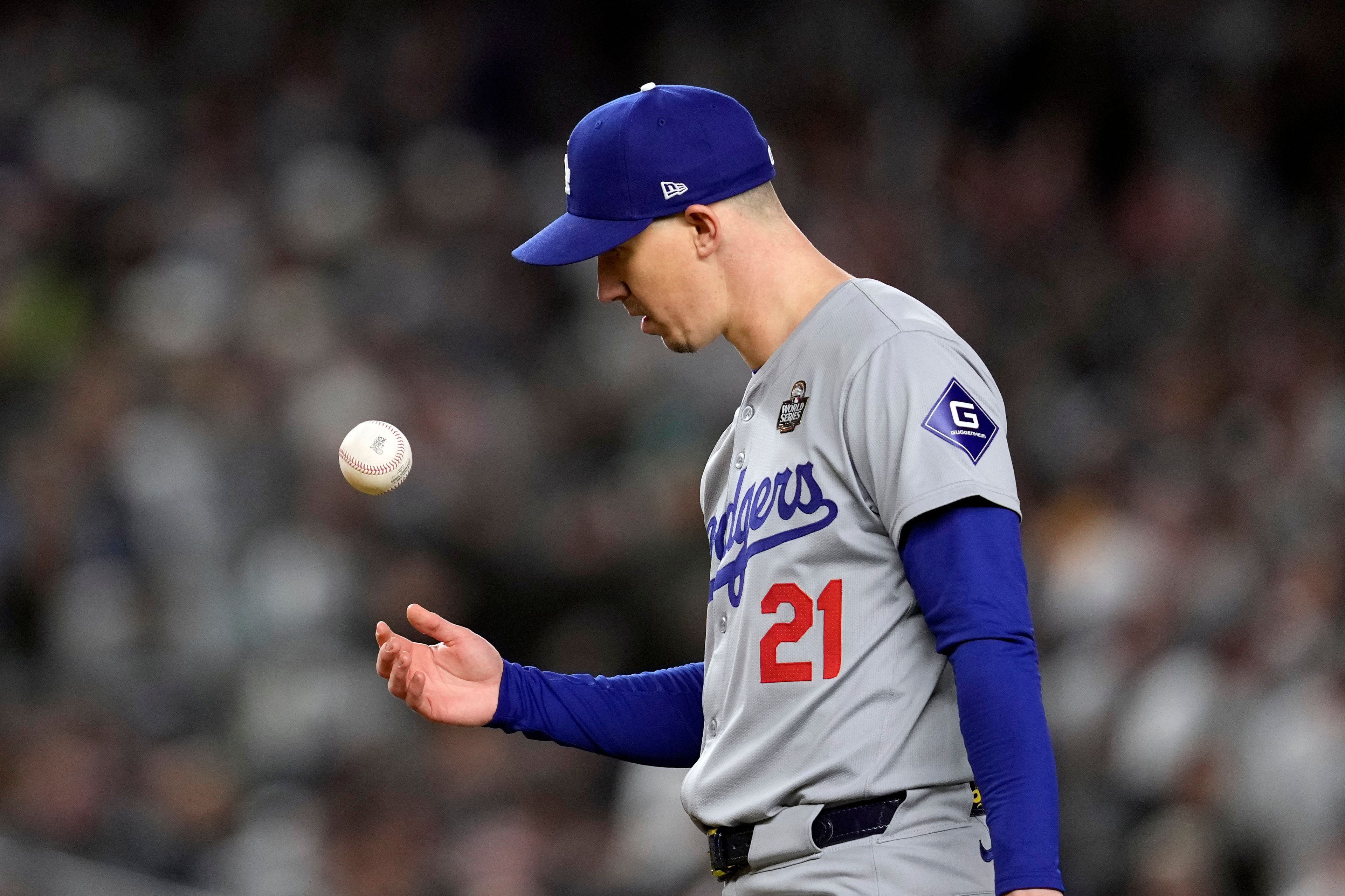 Los Angeles Dodgers starting pitcher Walker Buehler tosses the ball after walking New York Yankees' Gleyber Torres during the first inning in Game 3 of the baseball World Series, Monday, Oct. 28, 2024, in New York. (AP Photo/Godofredo A. Vásquez)