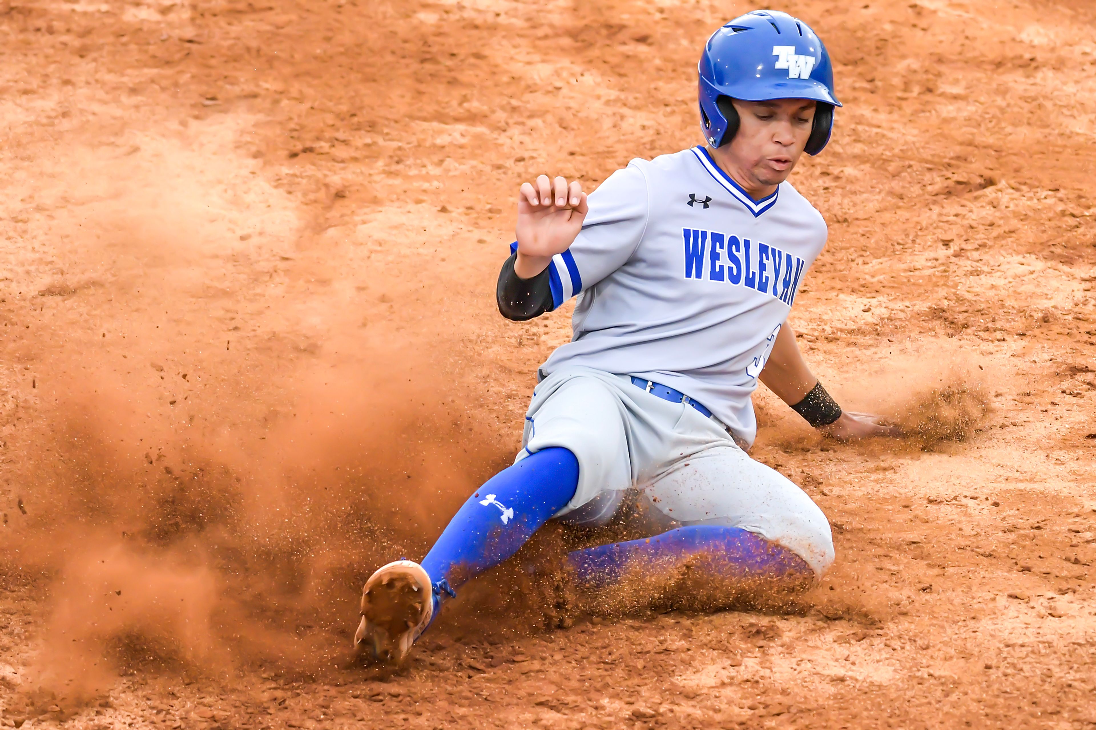 Tennessee Wesleyan’s Dante Leach slides into third base against Cumberlands during game 3 of the NAIA World Series at Harris Field Friday in Lewiston.