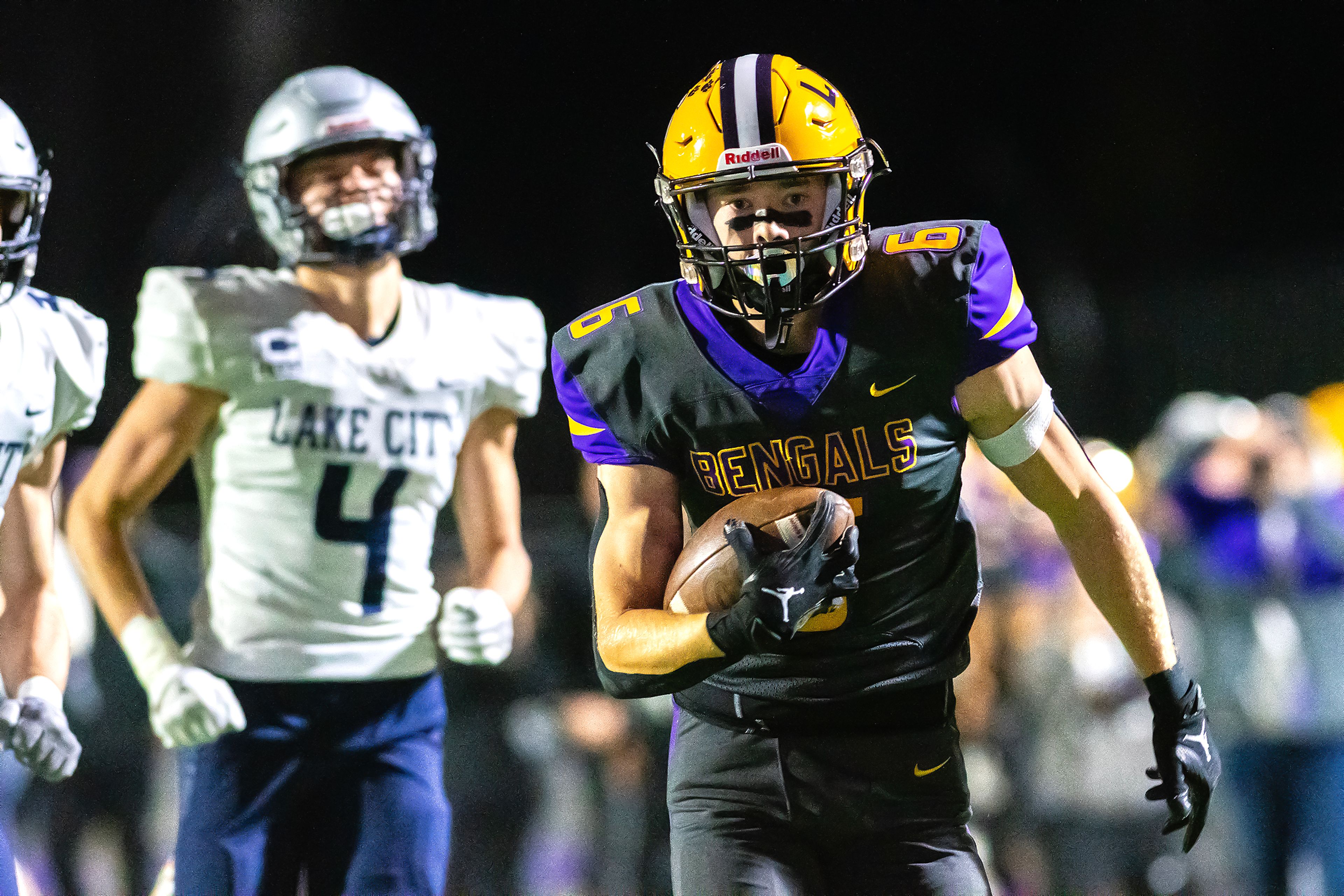 Lewiston wide receiver Nathan King runs the ball in for a touchdown against Lake City in a nonconference game Friday at Lewiston High School.,