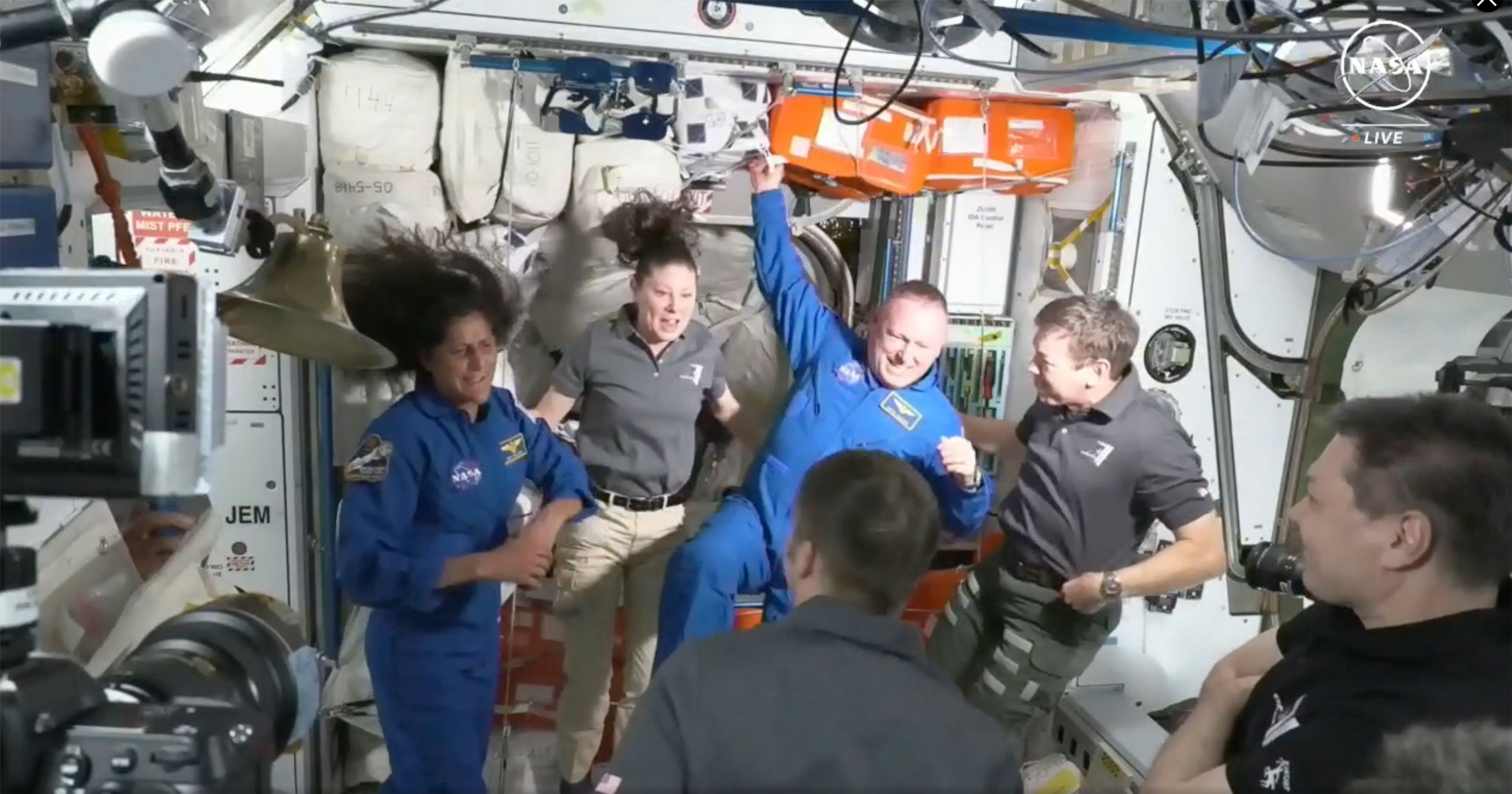 NASA astronauts Butch Wilmore and Suni Williams are greeted by the crew of the International Space Station on Thursday, June 6, 2024.