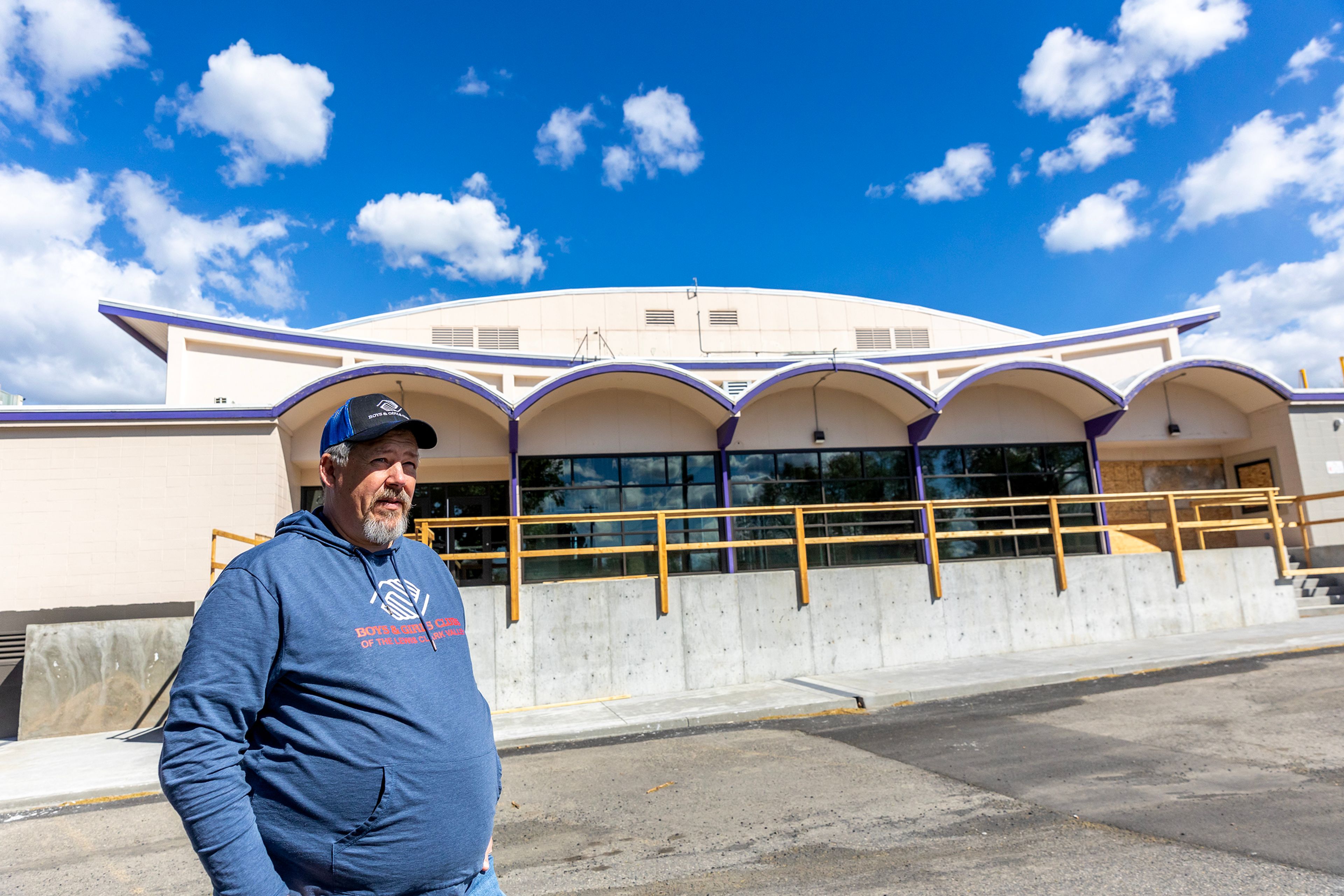 Jon Evans stands outside Booth Hall as renovations for the Boys and Girls Club continue Wednesday in Lewiston.