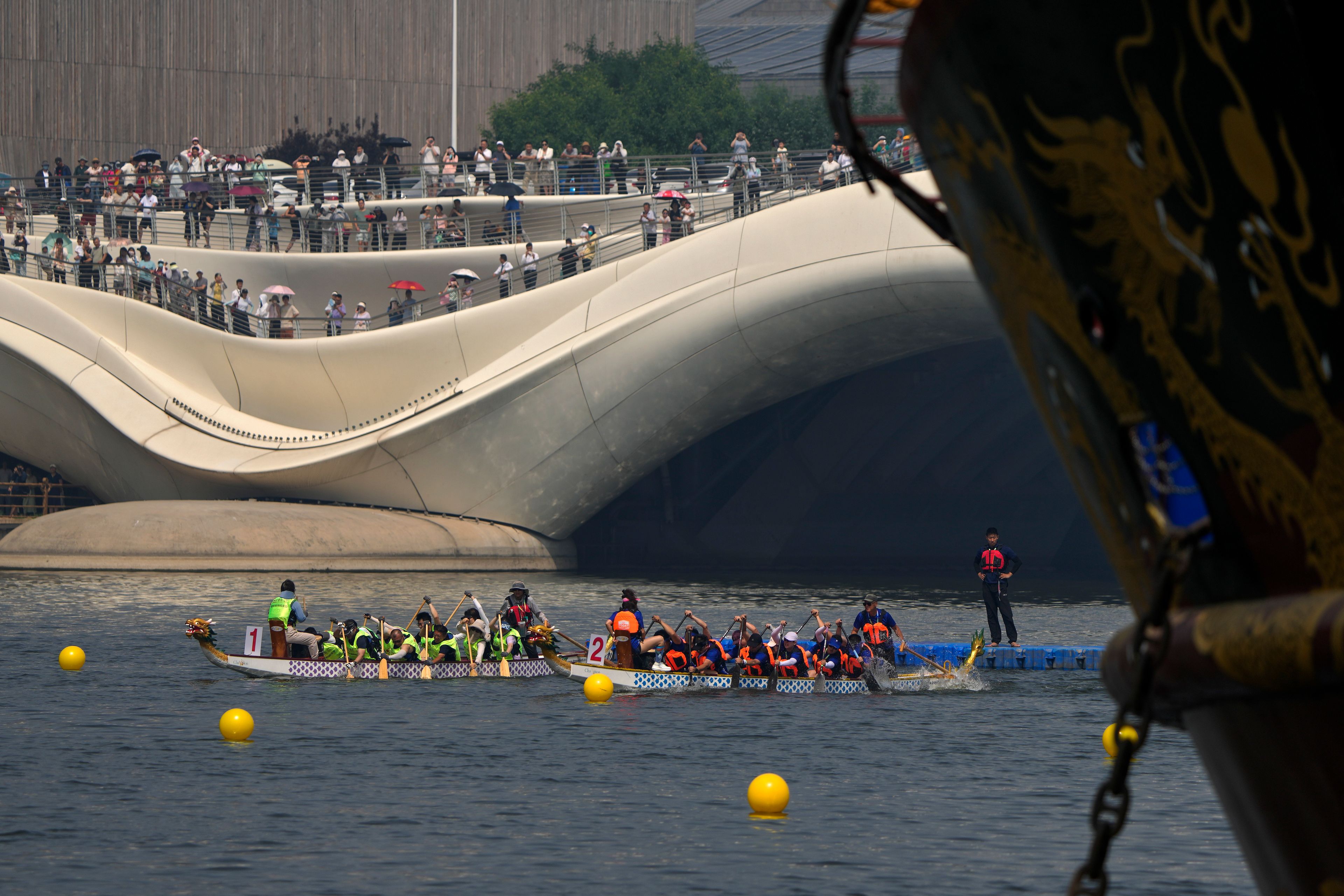 Competitors take part in a dragon boat race during the Dragon Boat Festival at a canal in Tongzhou, outskirts of Beijing, Monday, June 10, 2024. The Duanwu Festival, also known as the Dragon Boat Festival, falls on the fifth day of the fifth month of the Chinese lunar calendar and is marked by eating rice dumplings and racing dragon boats.