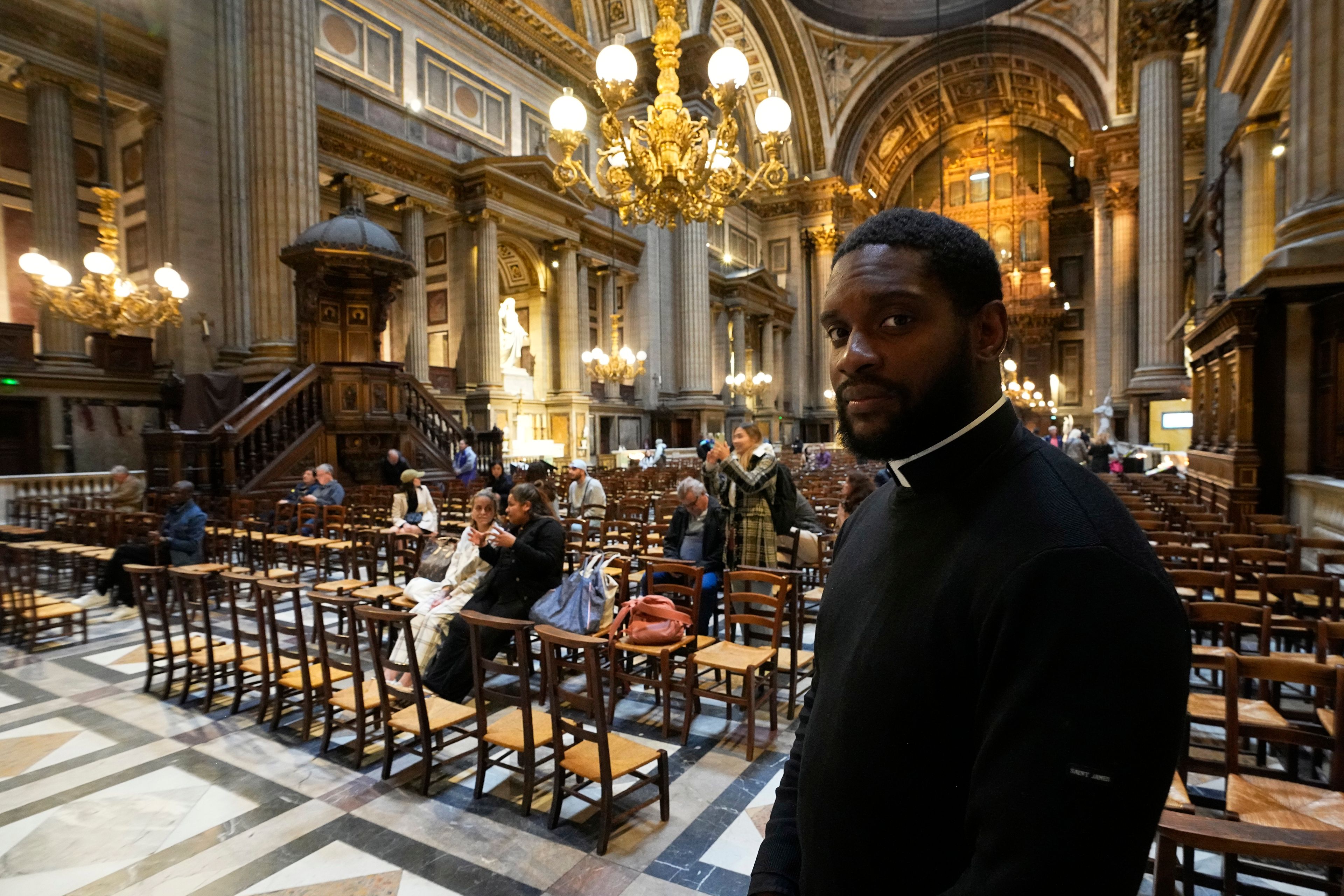 Jason Nioka,, a former judo champion and deacon who's in charge of the largest contingent of Olympic chaplains, about 40 priests, nuns and lay Catholics, poses inside the Madeleine church, Thursday, May 30, 2024 in Paris. As athletes rev up their training and organizers finalize everything from ceremonies to podiums before the Paris Olympics, more than 120 faith leaders are preparing for a different challenge – spiritually supporting some 14,000 participants from around the world, especially those whose medal dreams will inevitably get crushed.