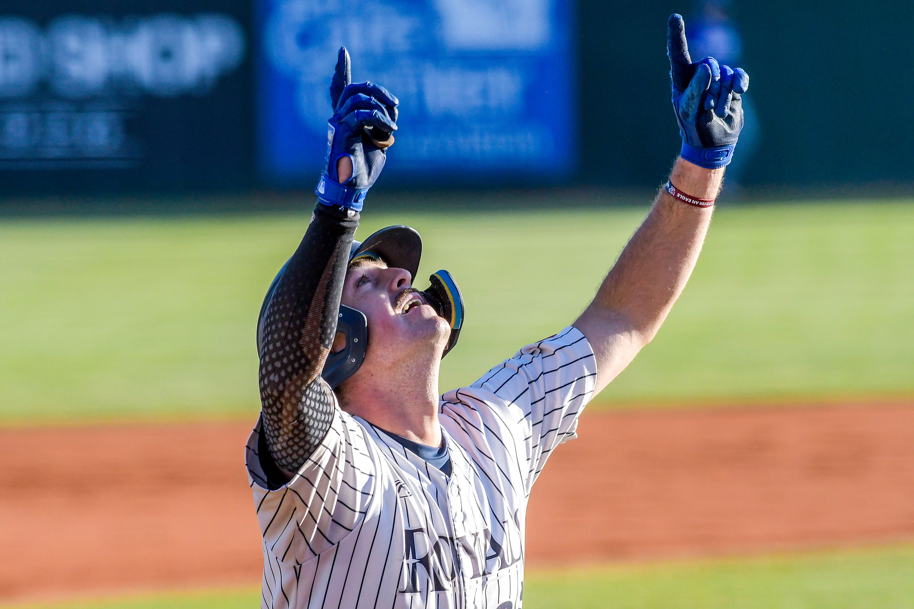 Hope International’s Alex Arnone points to the sky after a home run against Tennessee Wesleyan in Game 19 of the NAIA World Series at Harris Field Friday in Lewiston.