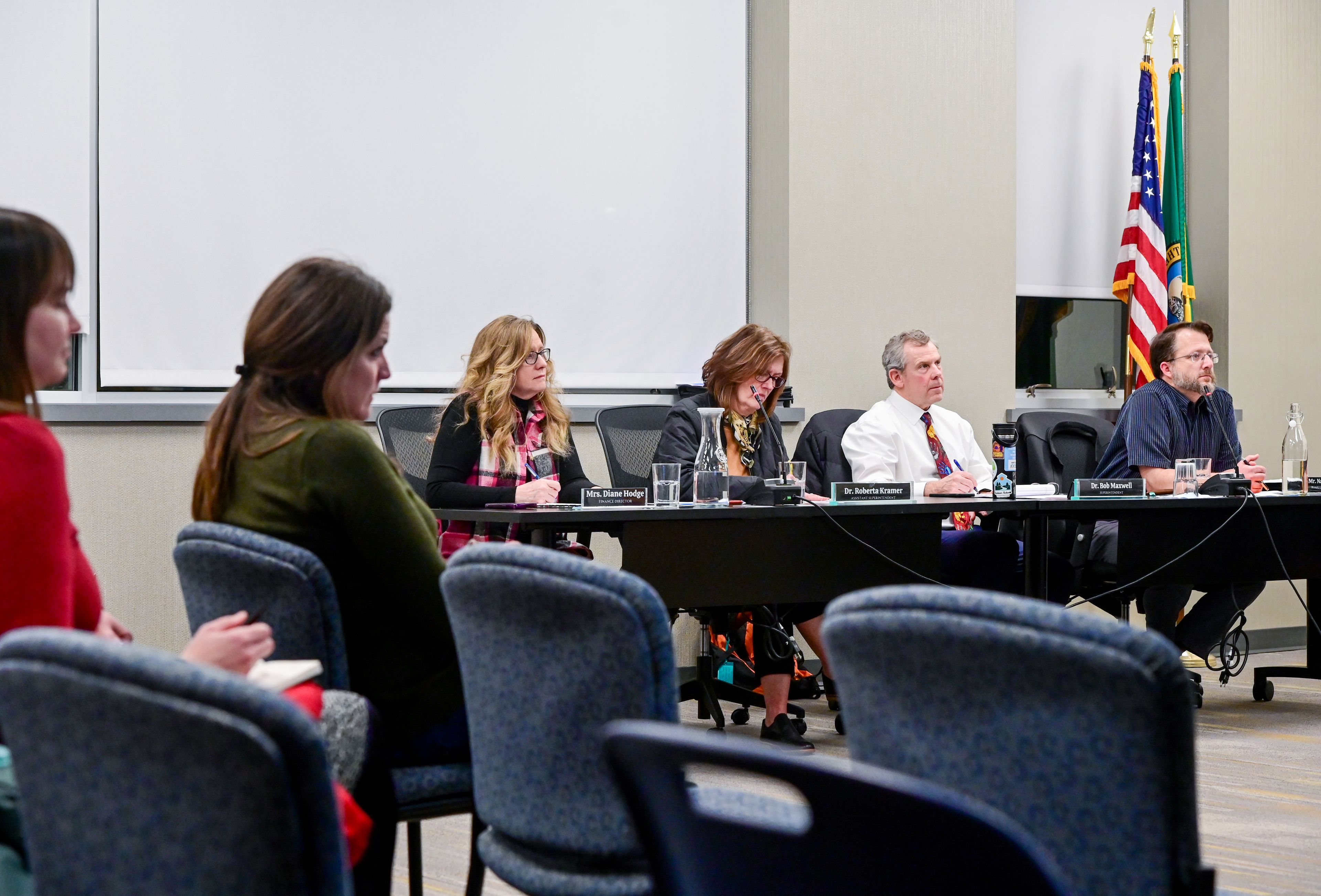 Members of the Pullman Public Schools administration and the Board of Directors listen to public comments at a meeting on Wednesday.