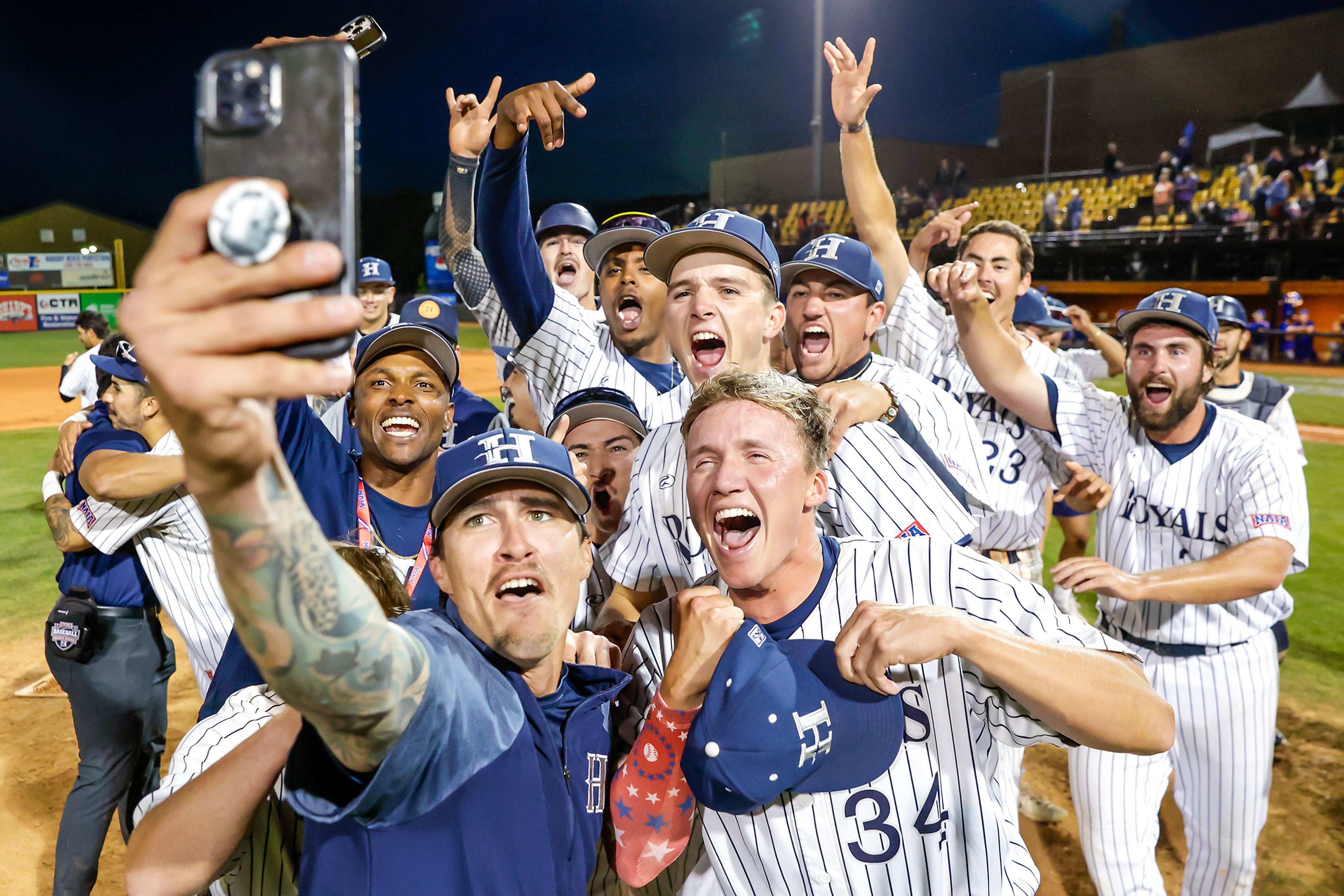 Hope International celebrates defeating Tennessee Wesleyan 13-6 in Game 19 of the NAIA World Series at Harris Field Friday in Lewiston.