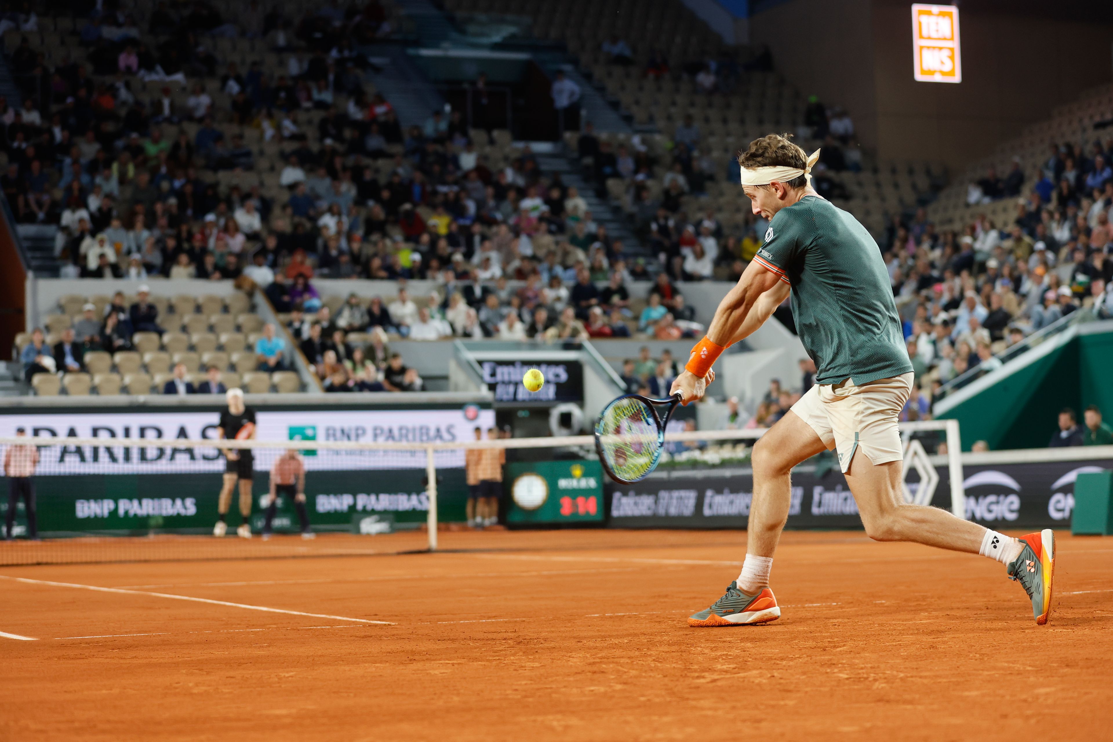 Norway's Casper Ruud plays a shot against Taylor Fritz of the U.S. during their fourth round match of the French Open tennis tournament at the Roland Garros stadium in Paris, Monday, June 3, 2024.