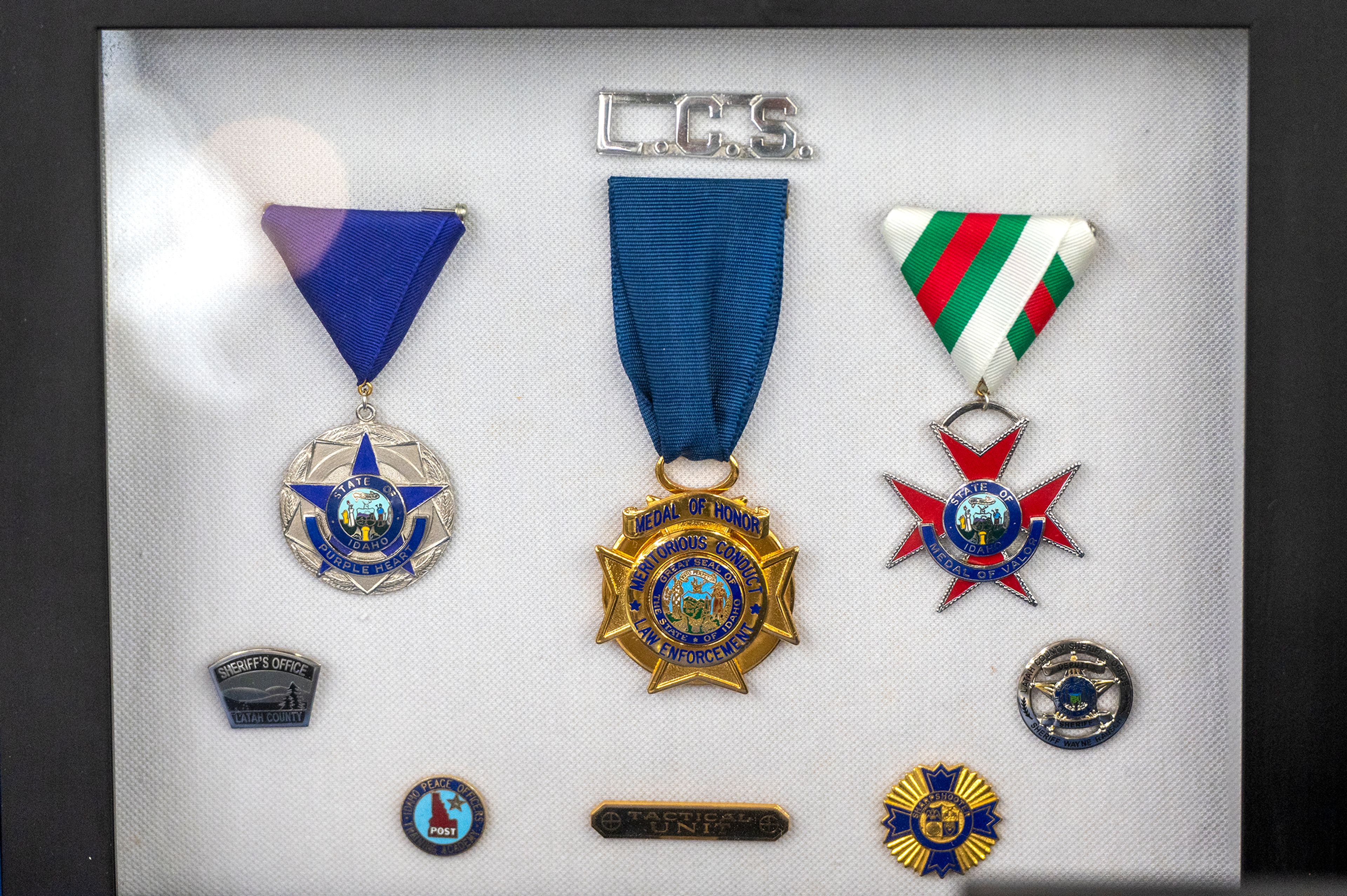 Medals, including a Purple Heart, Medal of Honor and a Medal of Valor, are displayed during Lt. Brannon Jordan’s retirement party Thursday at the Latah County Fair Office in Moscow.