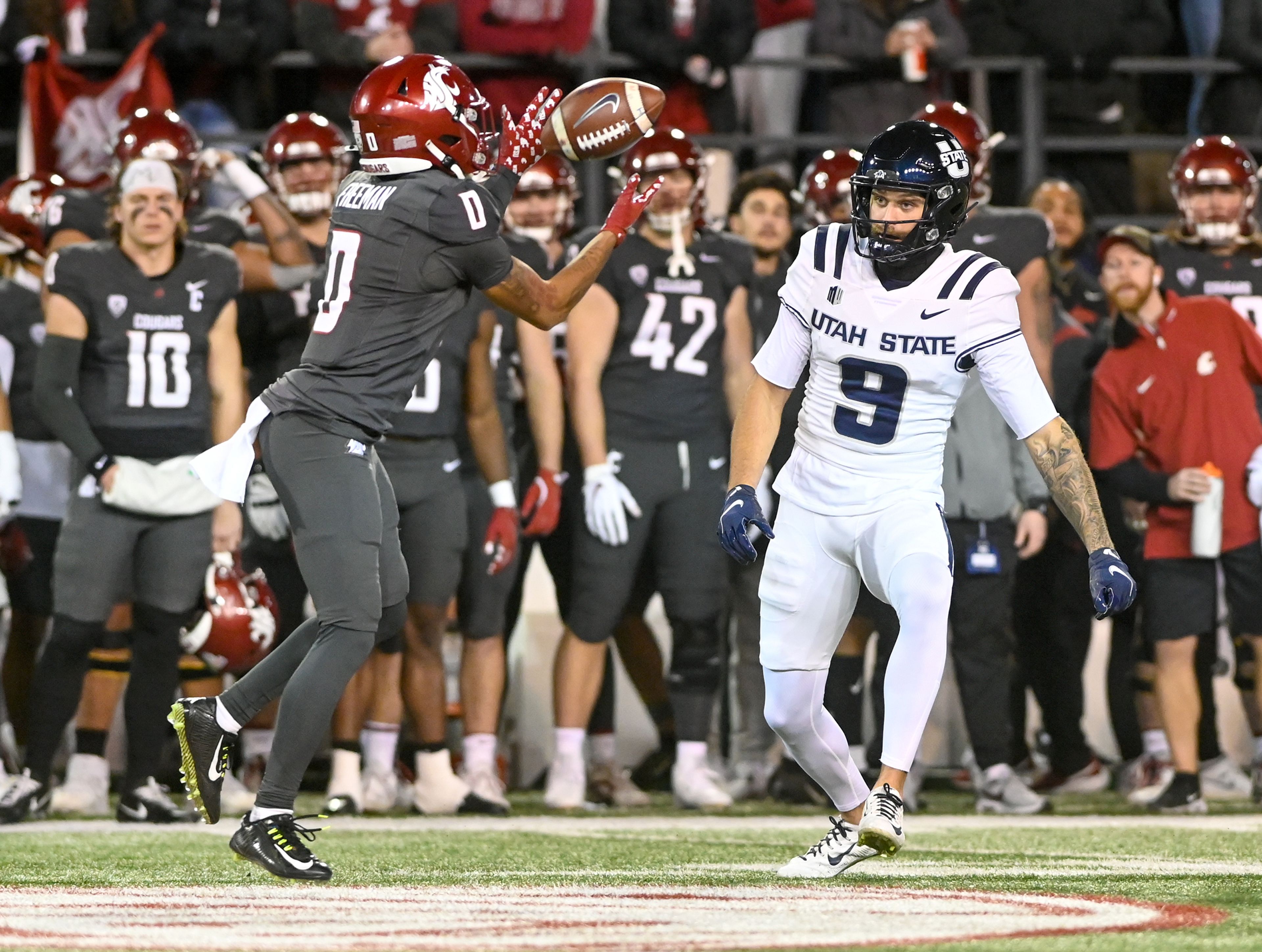 Washington State wide receiver Tony Freeman (0) catches the ball during a game against Utah State Saturday at Gesa Field in Pullman.