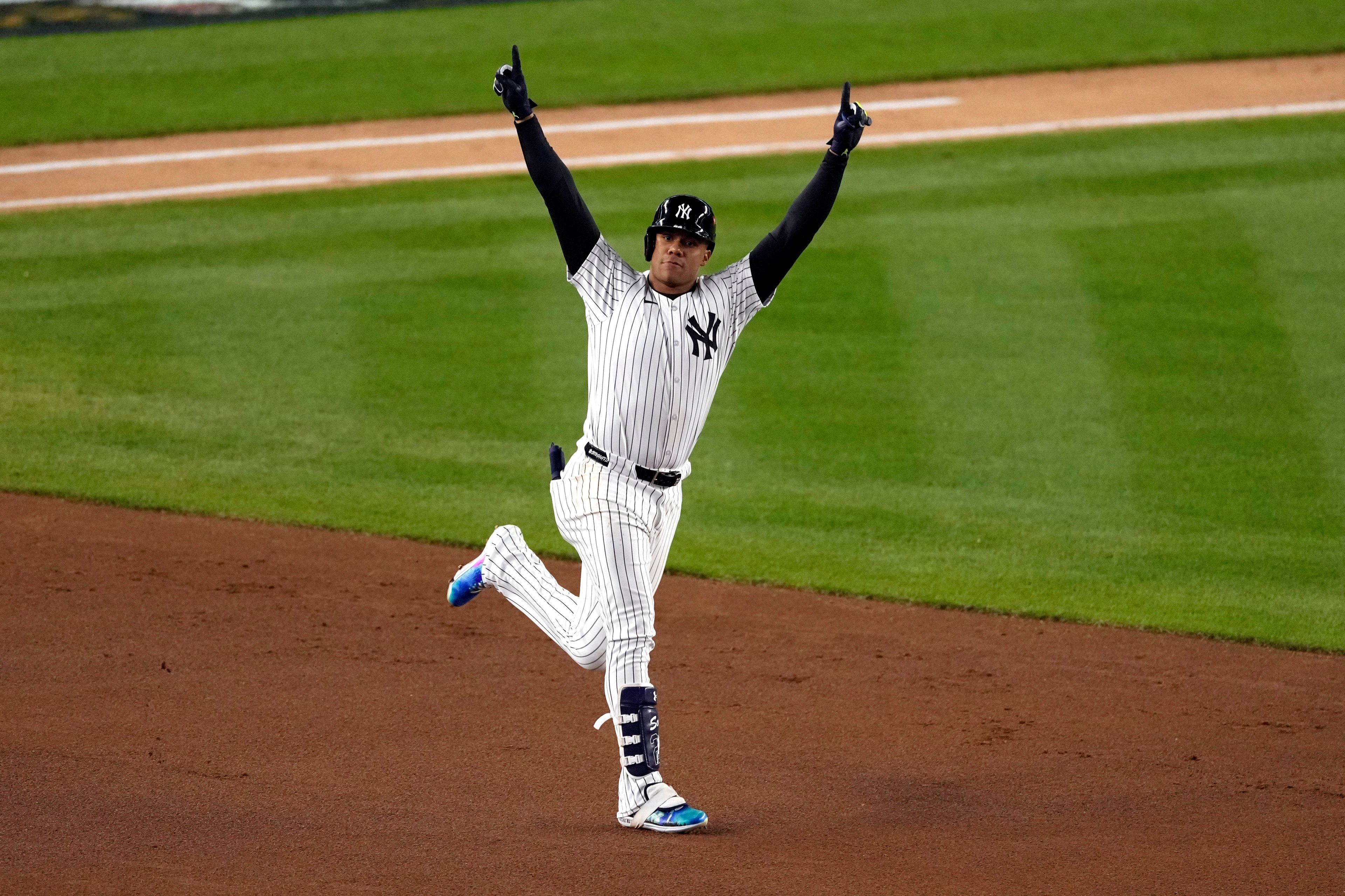 New York Yankees' Juan Soto celebrates after hitting a home run against the Cleveland Guardians during the third inning in Game 1 of the baseball AL Championship Series Monday, Oct. 14, 2024, in New York. (AP Photo/Seth Wenig)