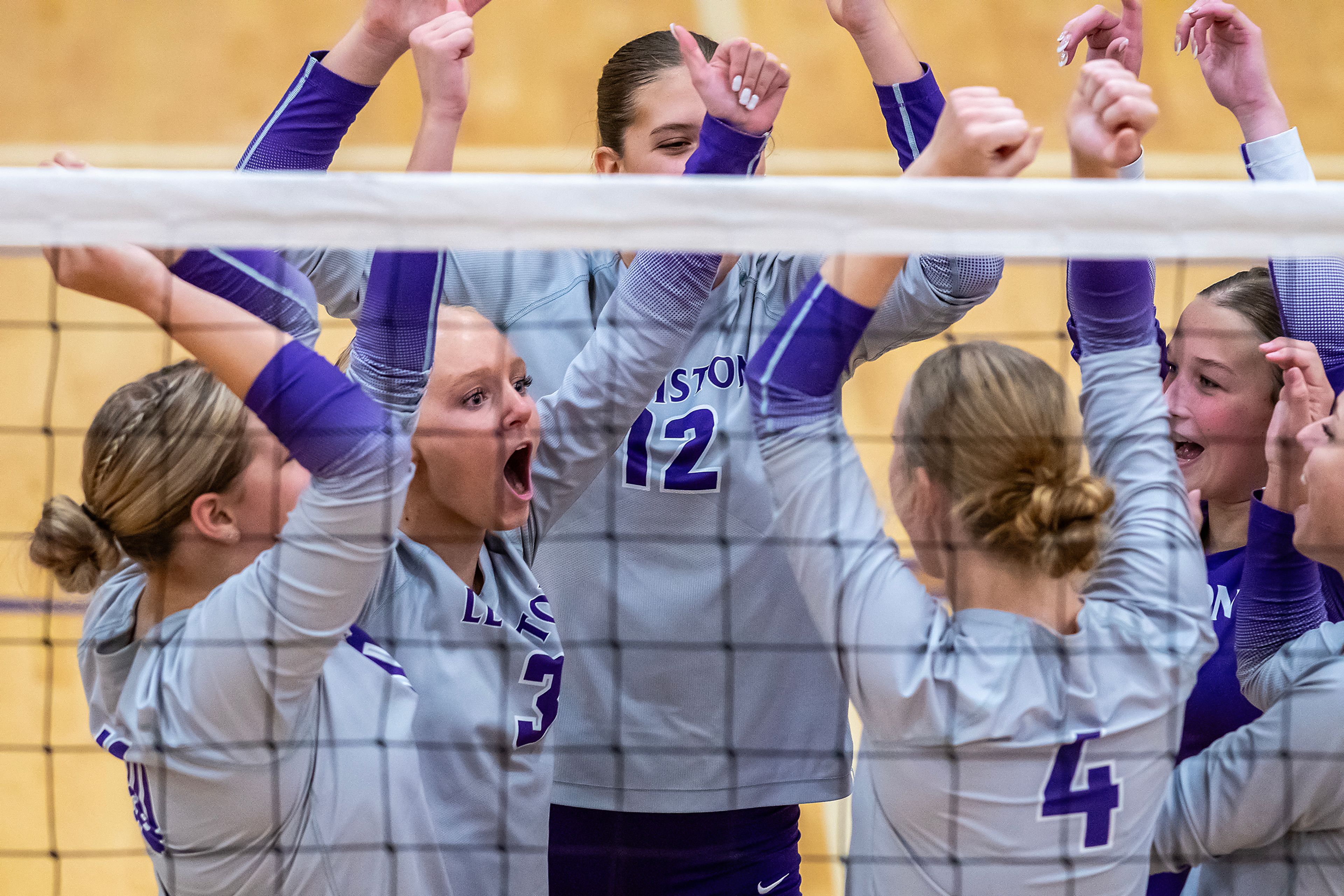 Lewiston celebrates a point against Sandpoint during a volleyball game Thursday in Lewiston.,