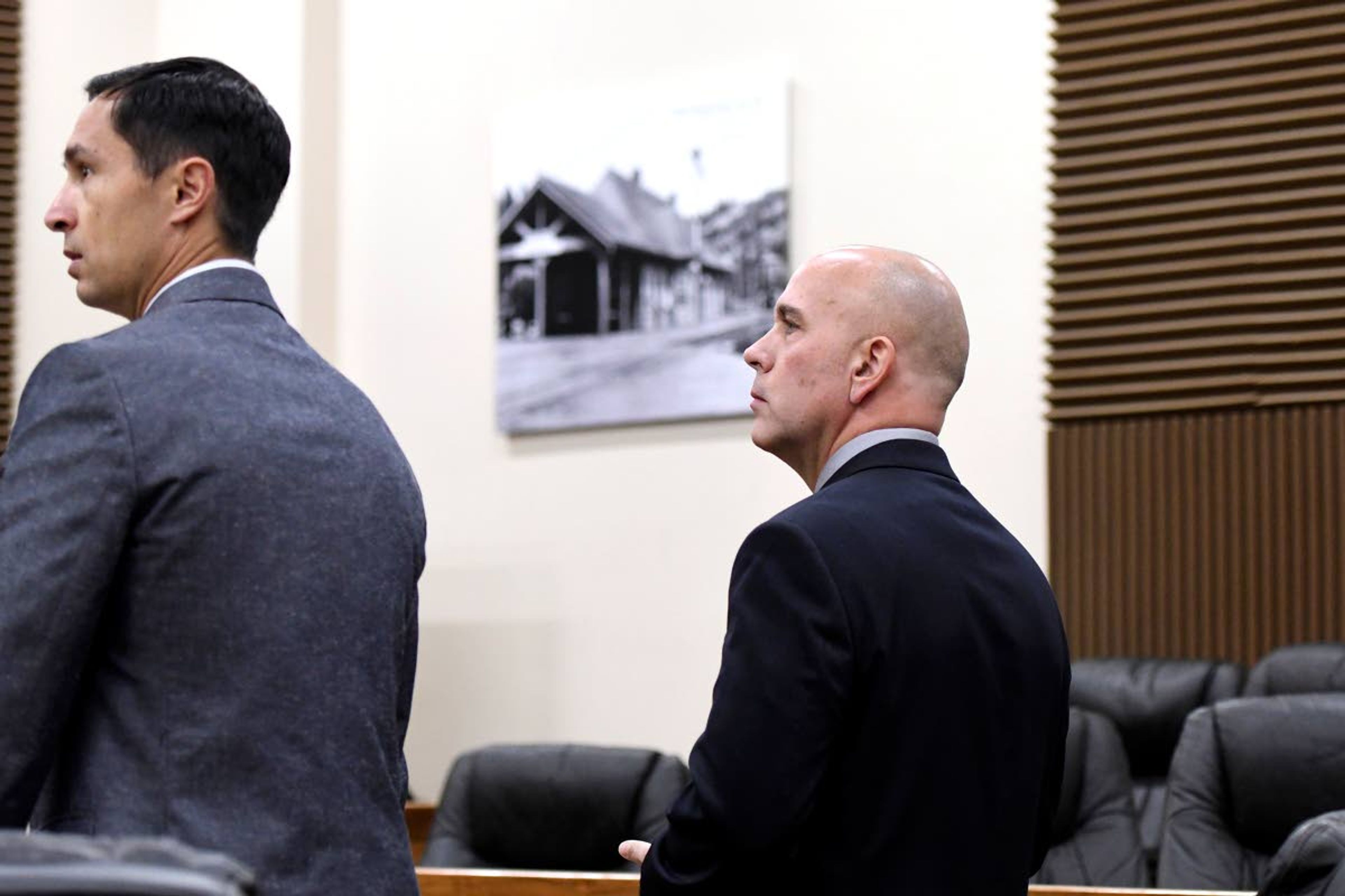 Pullman Police Sgt. Dan Hargraves (center) was represented by Pullman attorney Roger Sandberg at his arraignment Friday in Whitman County Superior Court in Colfax.