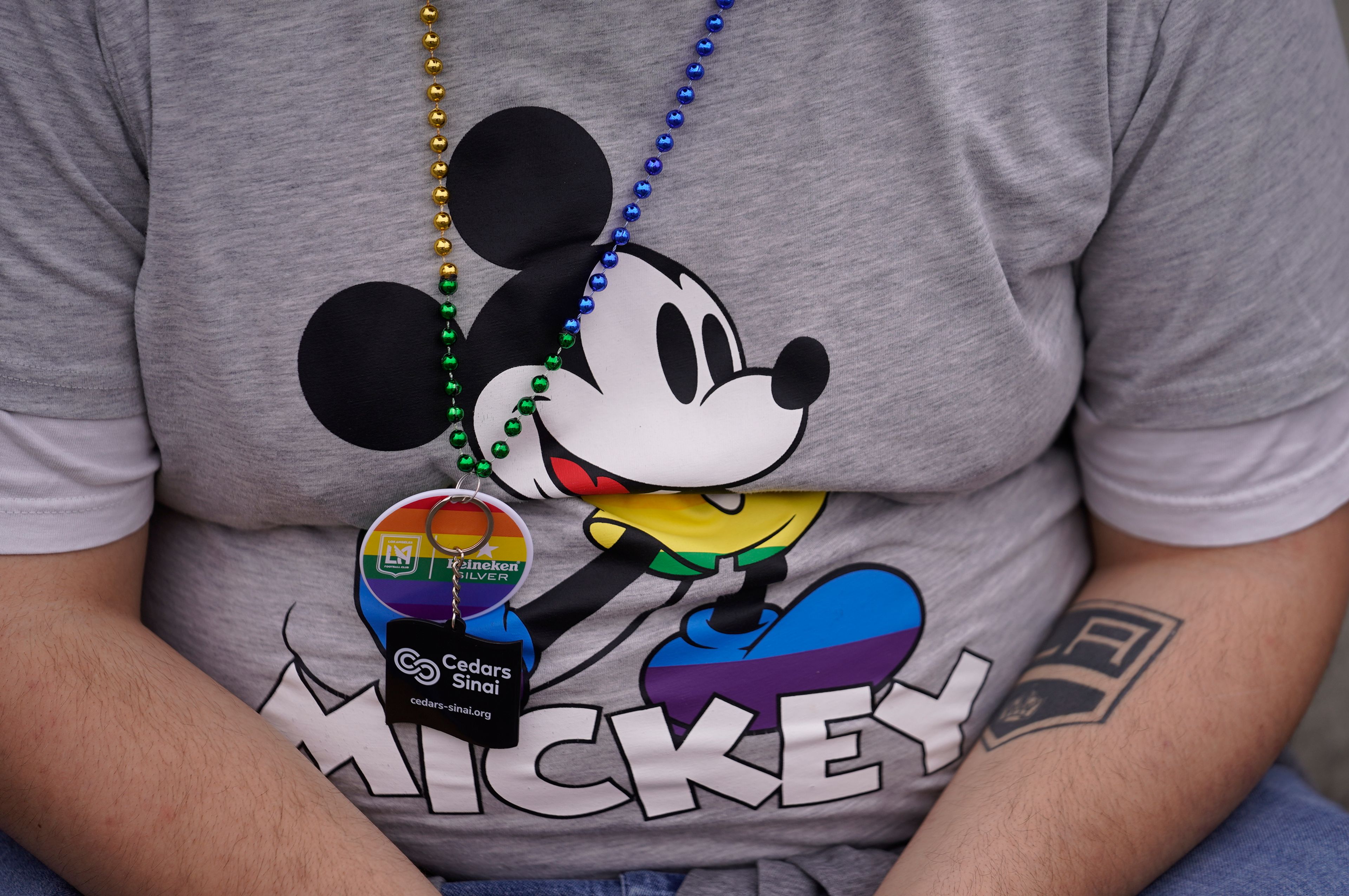 A Disney men's Mickey Mouse Pride graphic T-shirt is seen at the WeHo Pride Parade in West Hollywood, Calif., on Sunday, June 4, 2023. (AP Photo/Damian Dovarganes)