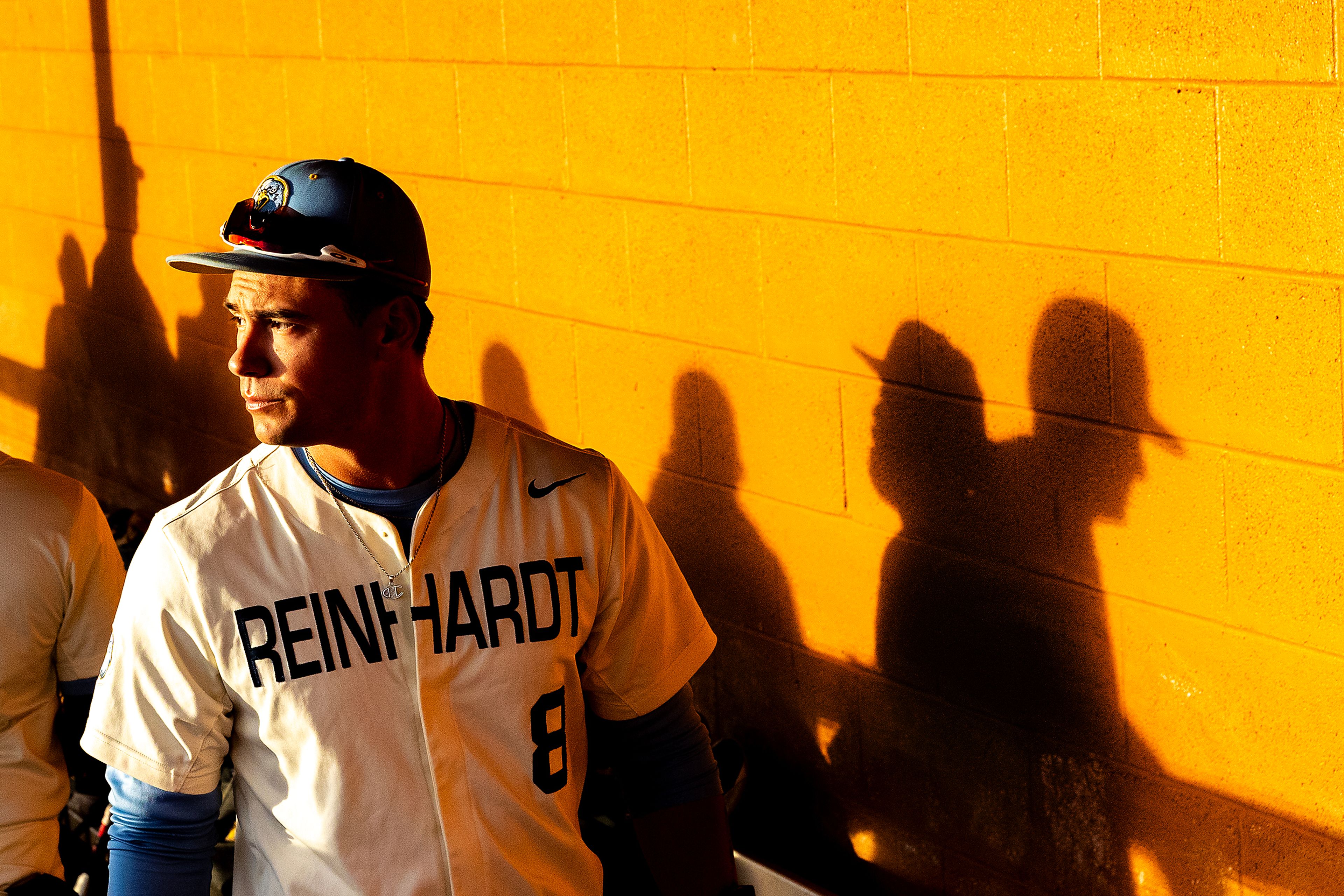 Reinhardt’s Dylan Lewis looks out from the dugout prior to their game against Georgia Gwinnett Tuesday at the NAIA World Series in Lewiston.