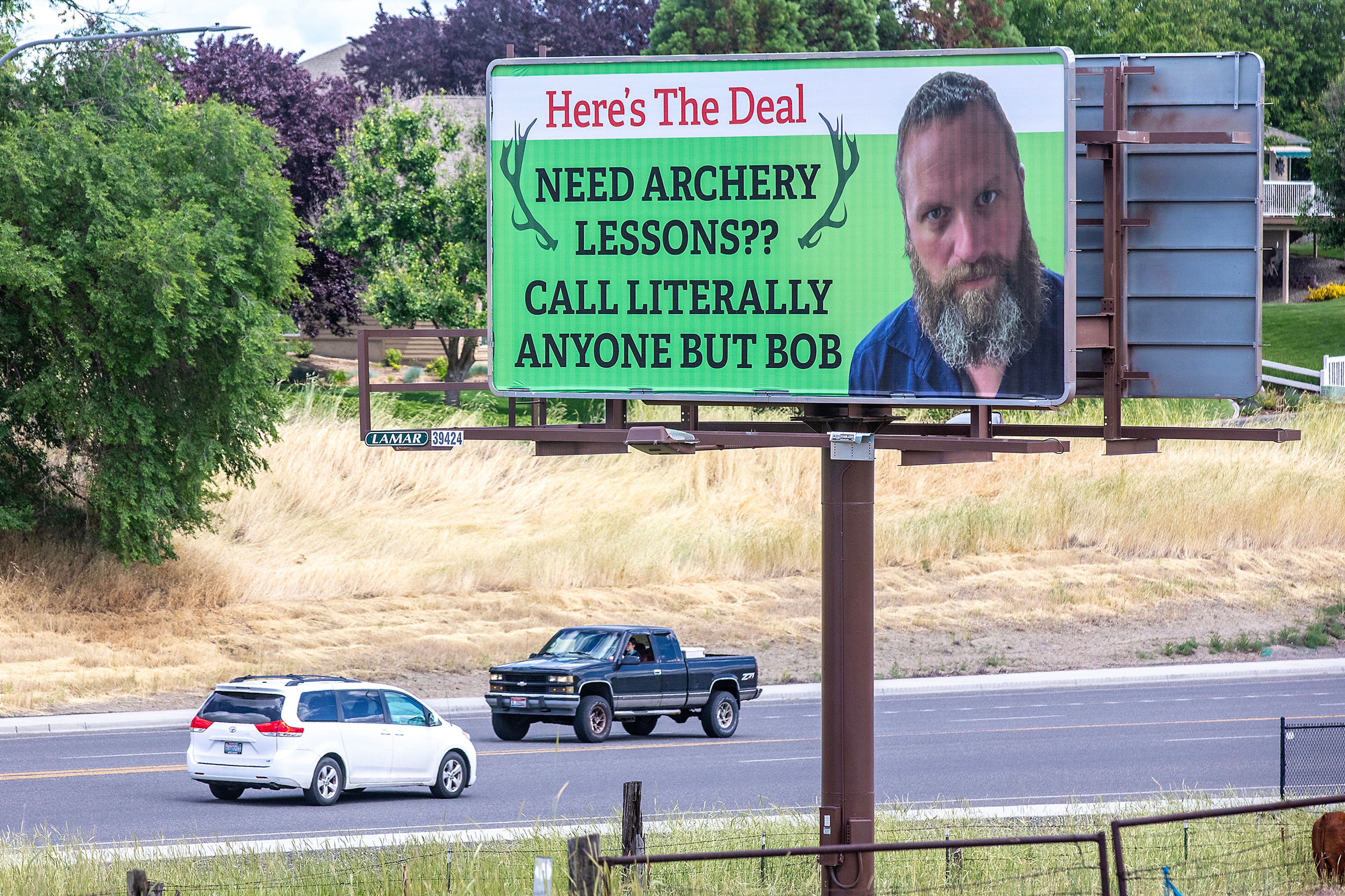 A billboard along Fleshman Way advises people to call anyone but Bob for archery lessons last week in Clarkston.