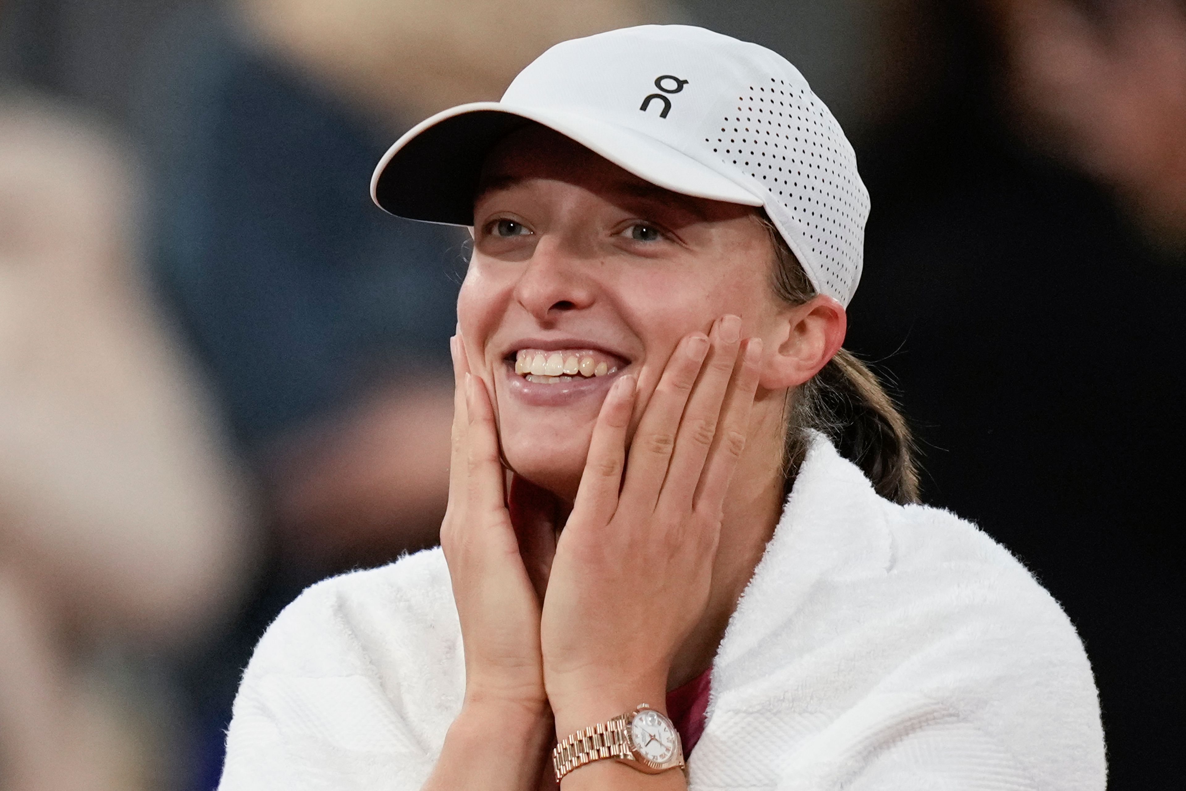 Poland's Iga Swiatek is all smiles as the audience sings Happy Birthday after her third round match of the French Open tennis tournament at the Roland Garros stadium in Paris, Friday, May 31, 2024.