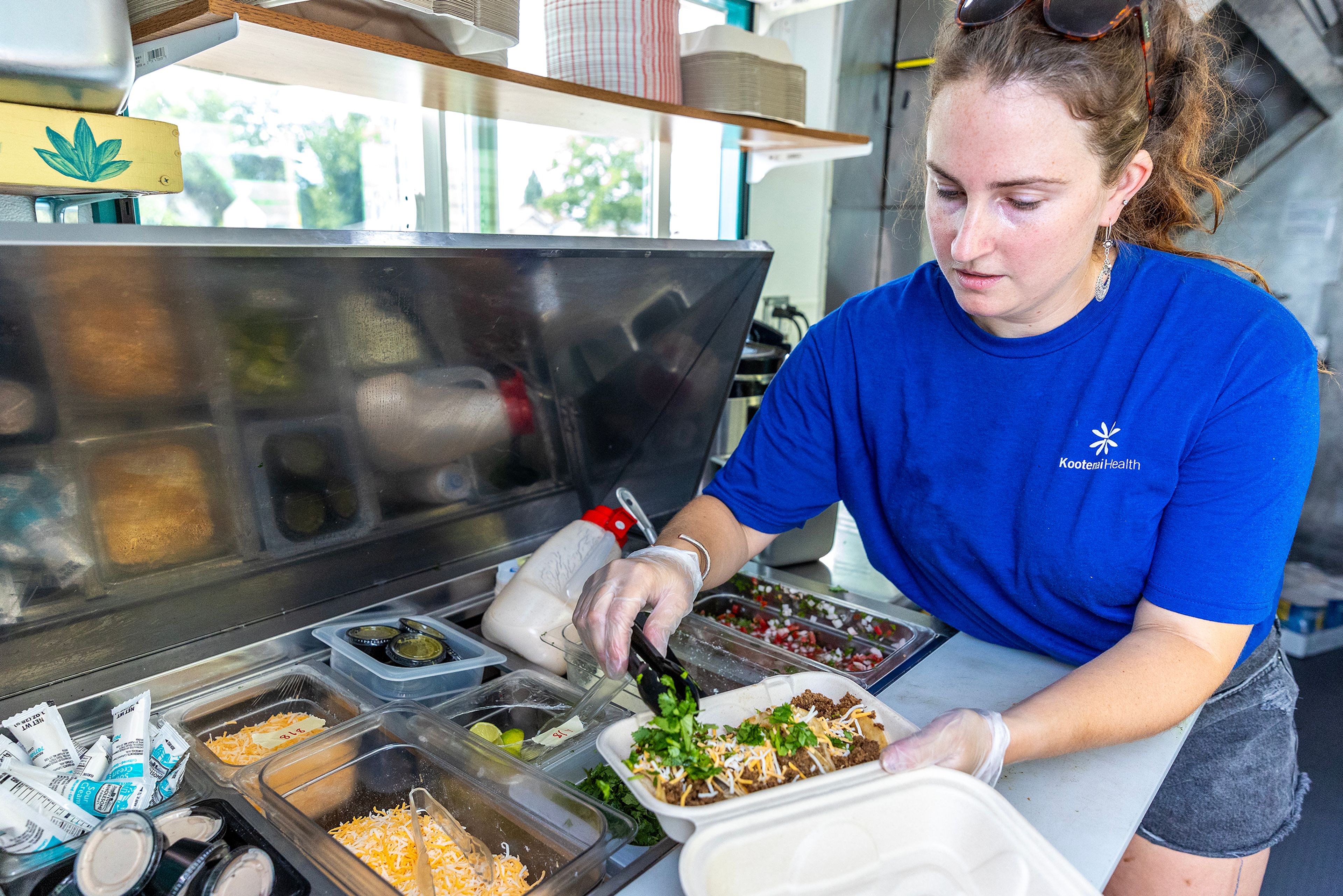 Miranda Thompson prepares ground beef street tacos at her food truck Peppers Taqueria outside The Hilltop on Friday, Aug. 9, in Grangeville.