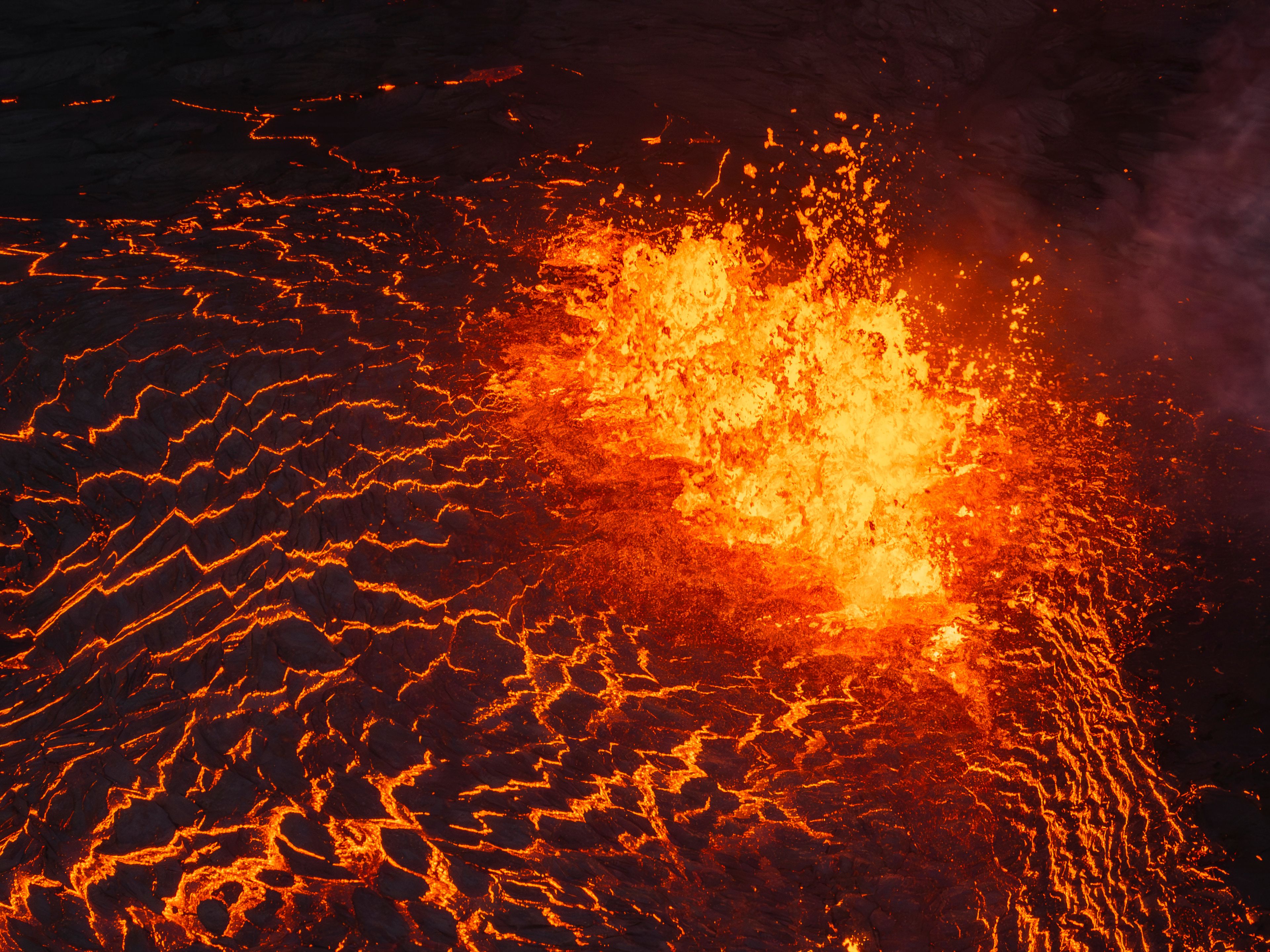 Lava flows from a volcano in Grindavik, Iceland, Wednesday, May 29, 2024. A volcano in southwestern Iceland erupted Wednesday for the fifth time since December, spewing red lava that once again threatened the coastal town of Grindavik and led to the evacuation of the popular Blue Lagoon geothermal spa.