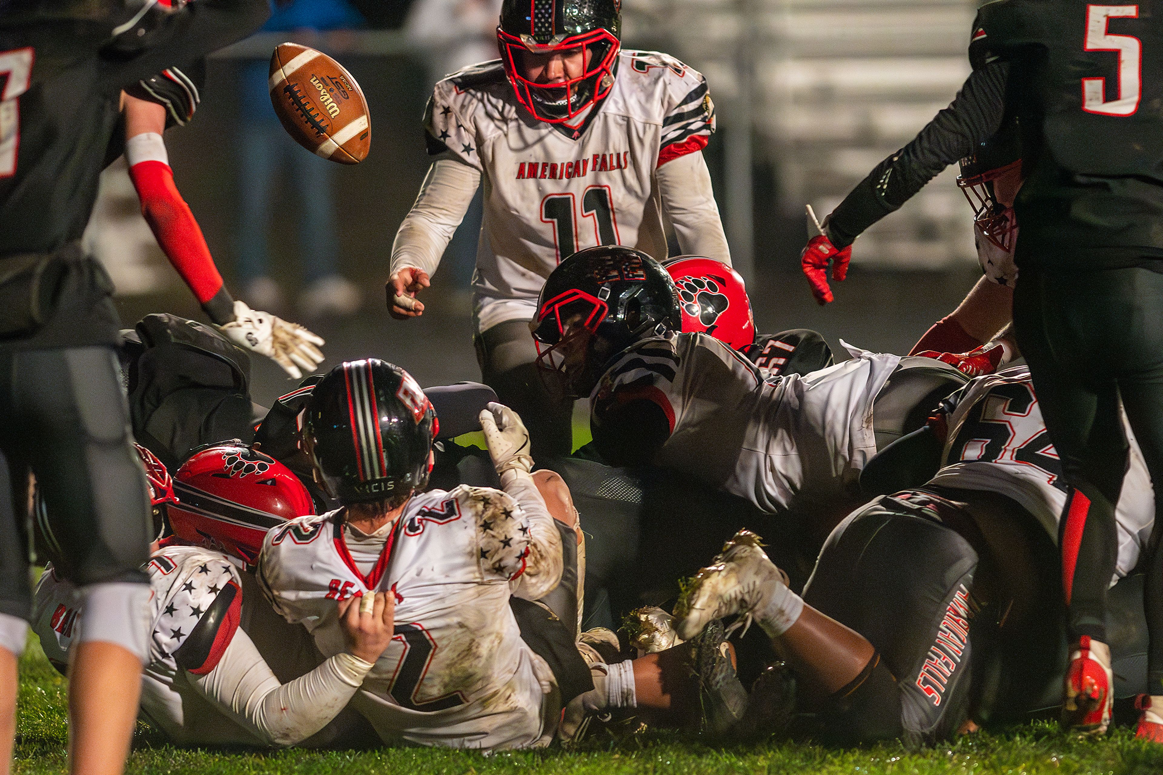 The ball bounces out of a pileup but not before officials call it a touchdown by American Falls against Moscow during an Idaho 4A playoff game Friday in Moscow.