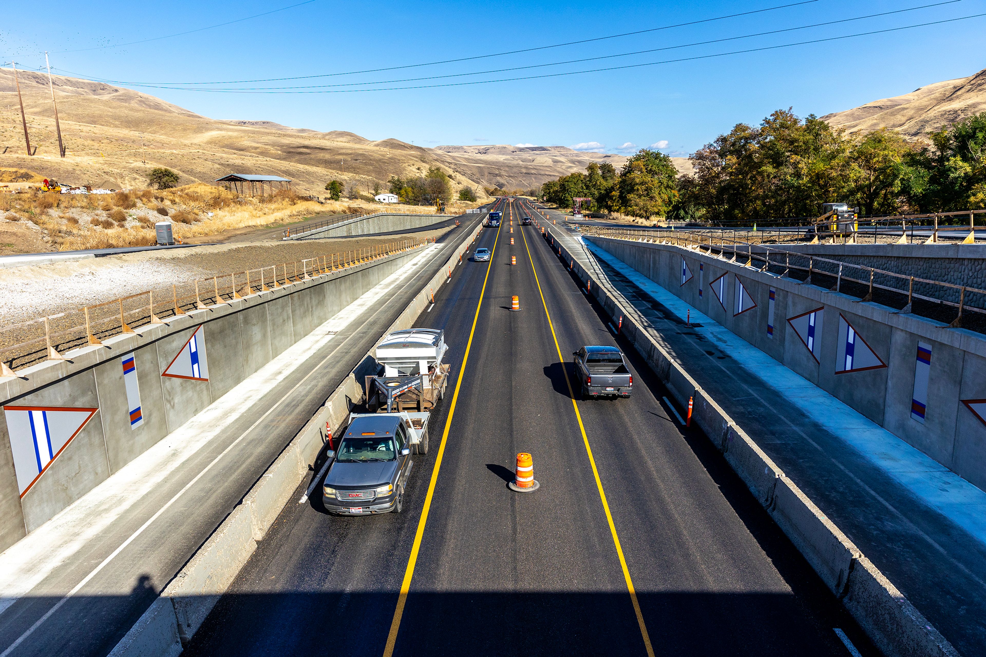 Cars move under the Aht�Wy Interchange during the ribbon cutting ceremony Thursday over U.S. Highway 95/12 in Lewiston.