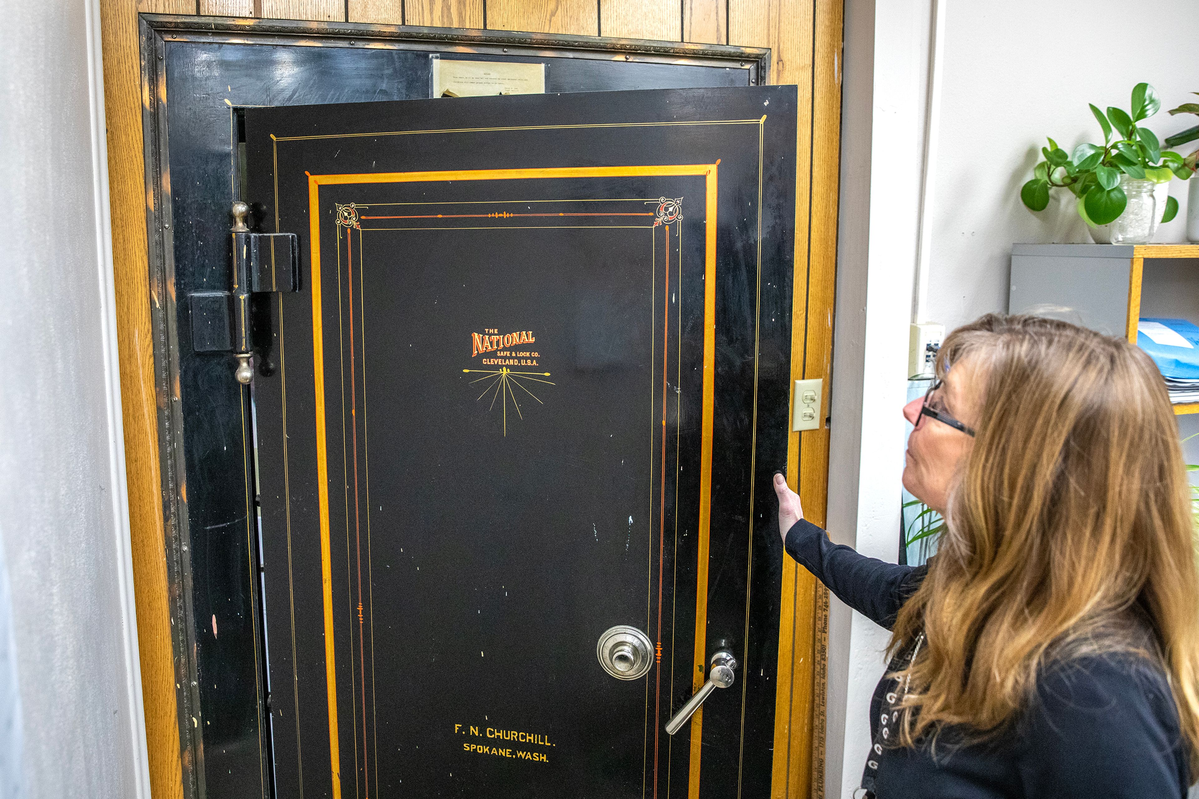 Patty Weeks opens one of the metal safe doors that will be saved and put in the new courthouse Friday at the Nez Perce County Courthouse in Lewiston.