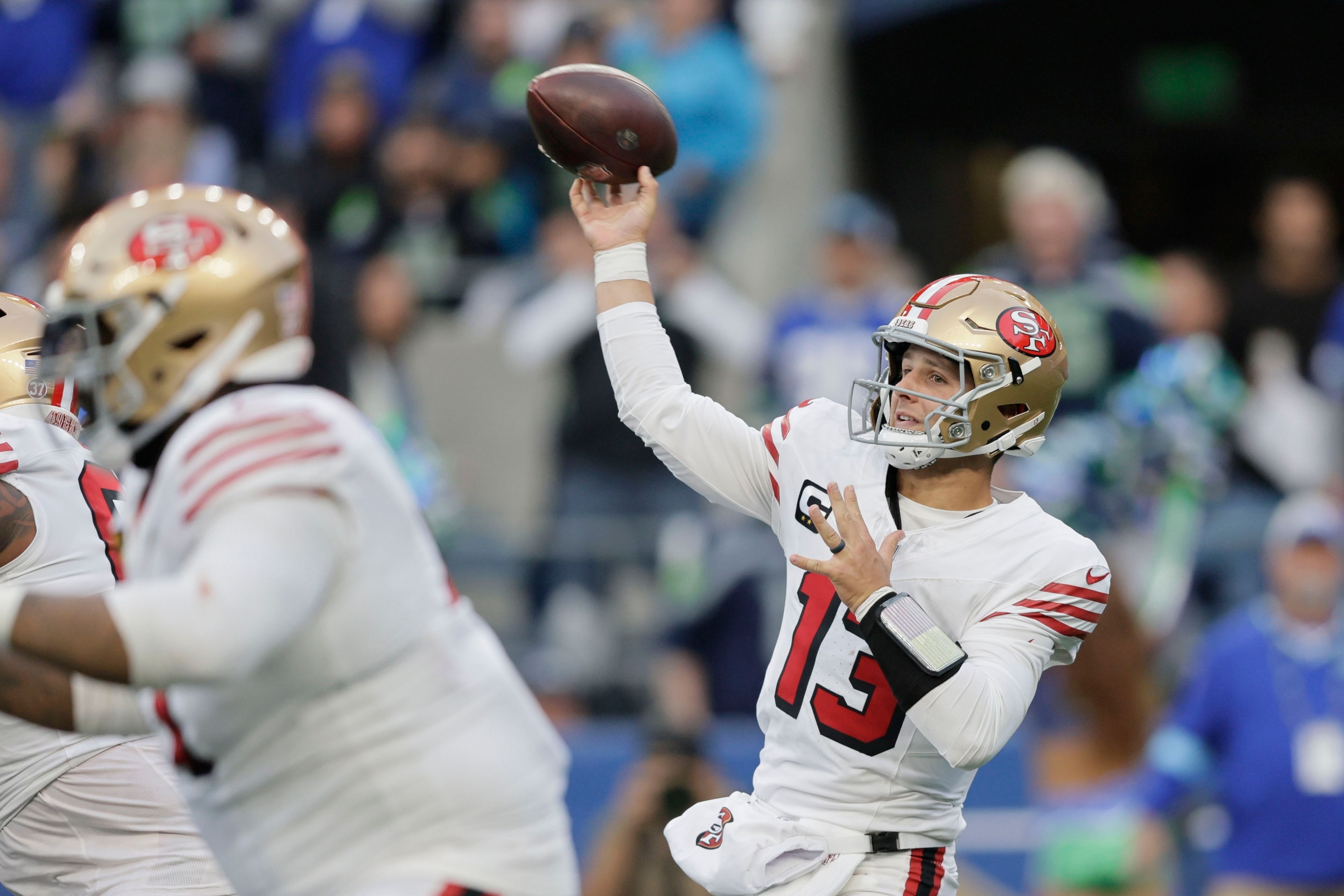 San Francisco 49ers quarterback Brock Purdy throws during the first half of an NFL football game against the Seattle Seahawks, Thursday, Oct. 10, 2024, in Seattle. (AP Photo/John Froschauer)