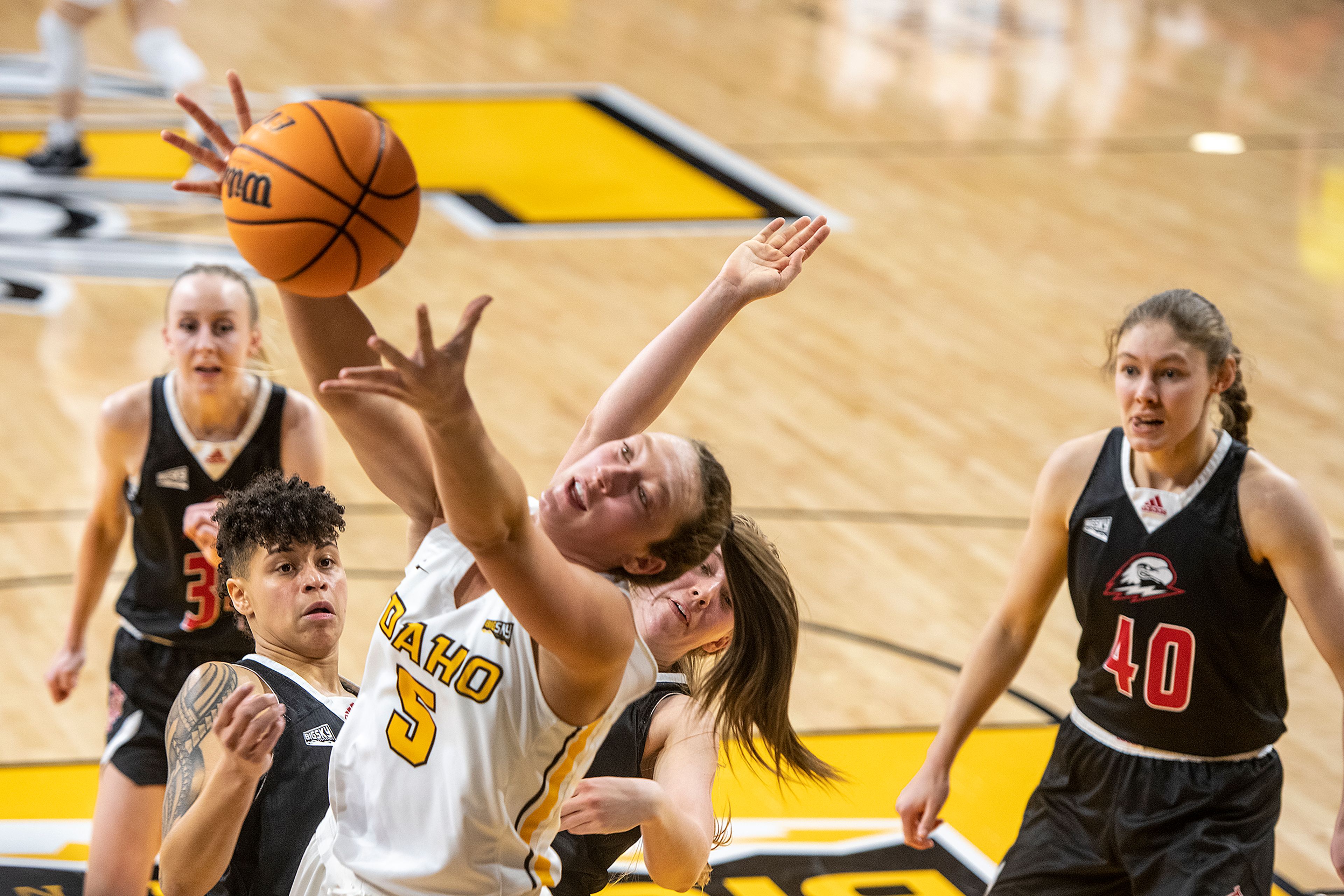 Idaho’s Beyonce Bea, left, grabs an offensive rebound during the second quarter of a Feb. 3, 2022, Big Sky Conference game against Southern Utah at Idaho Central Credit Union Arena. Bea leads the conference in scoring at 22.8 points per game.